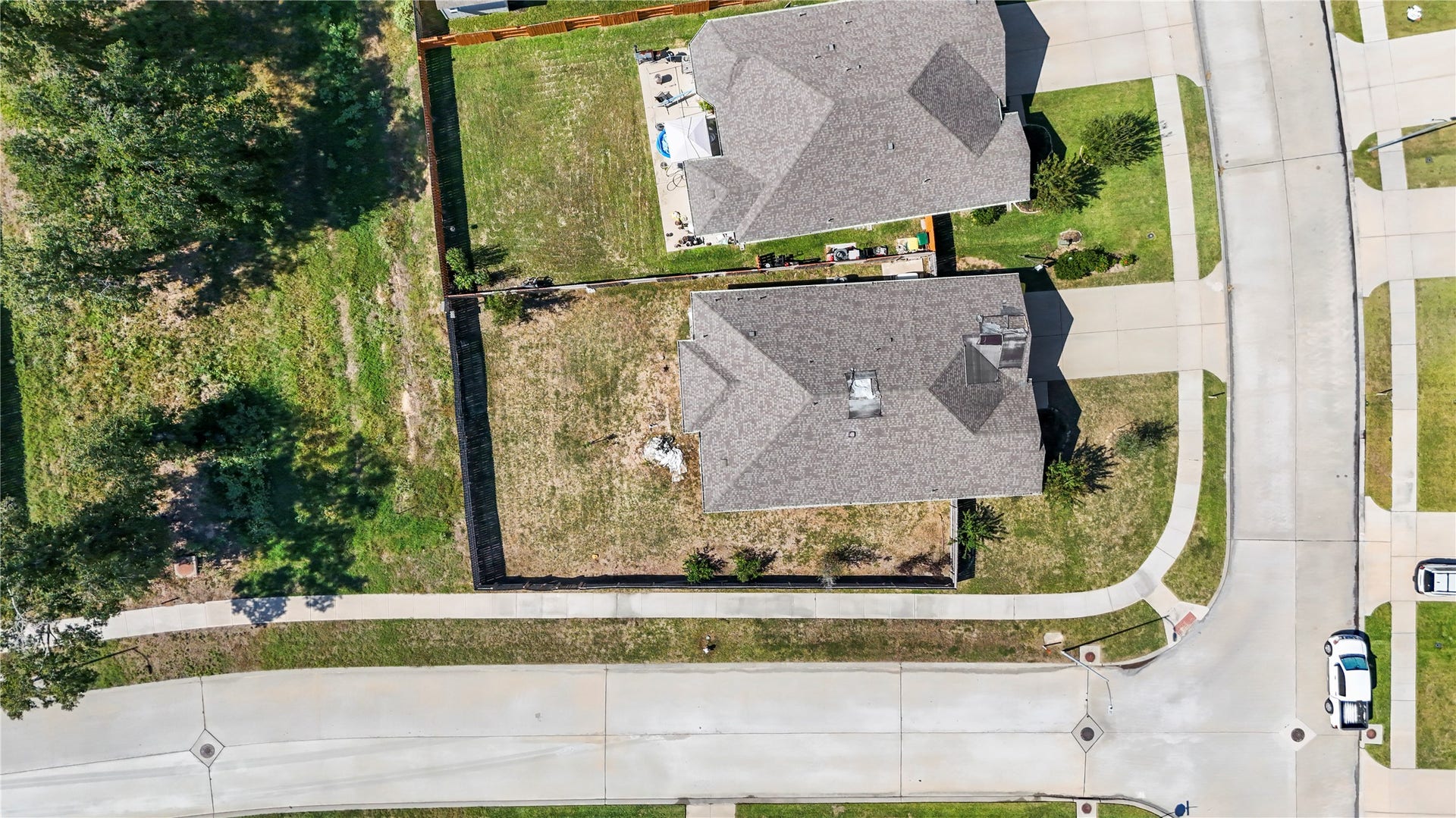 12805 S Winding Pines Drive, Tomball, TX 77375 This corner lot not only gives you extra room but the backyard backs up to a green space with large trees.