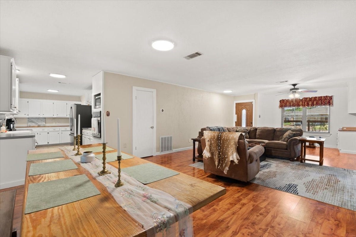 1209 E Brown Lane, Deer Park, TX 77536 Spacious open-concept living area hardwood floors. Flex living space that can be used with a dining table as well.