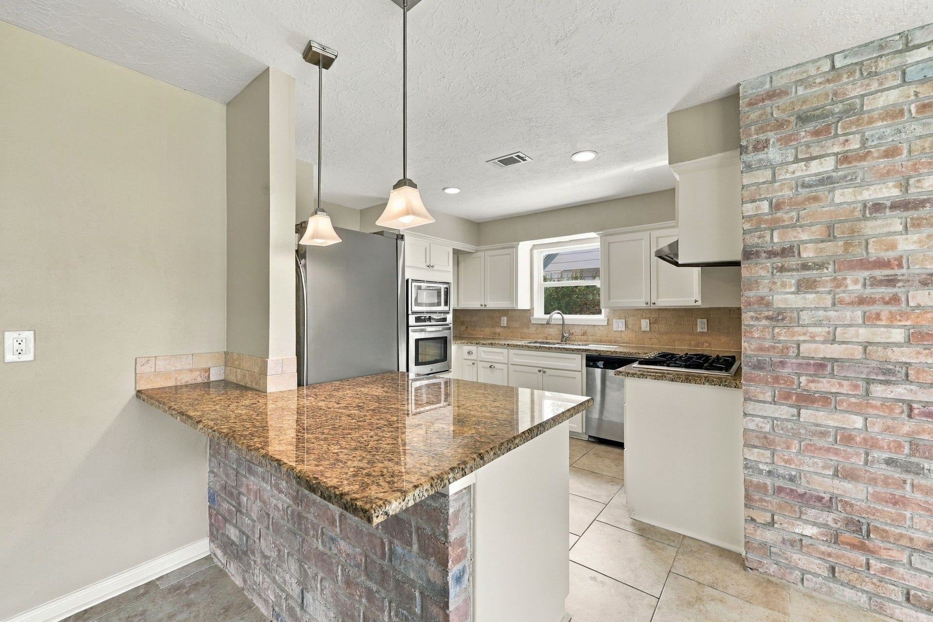 11310 Olympia Drive, Houston, TX 77077 Counter space with its beautiful brick accent walls.
