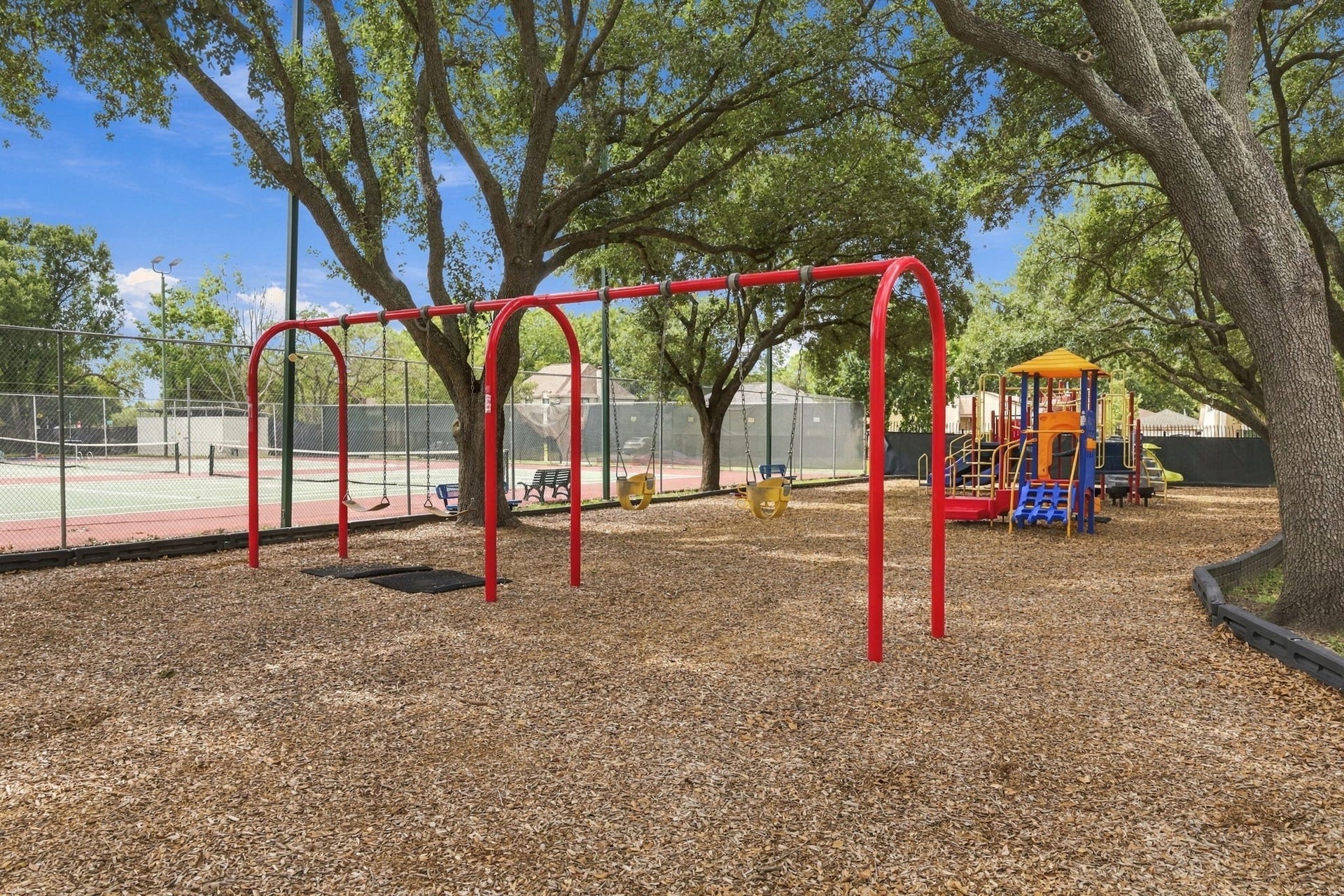11310 Olympia Drive, Houston, TX 77077 Enjoy this playground area next to the tennis courts.