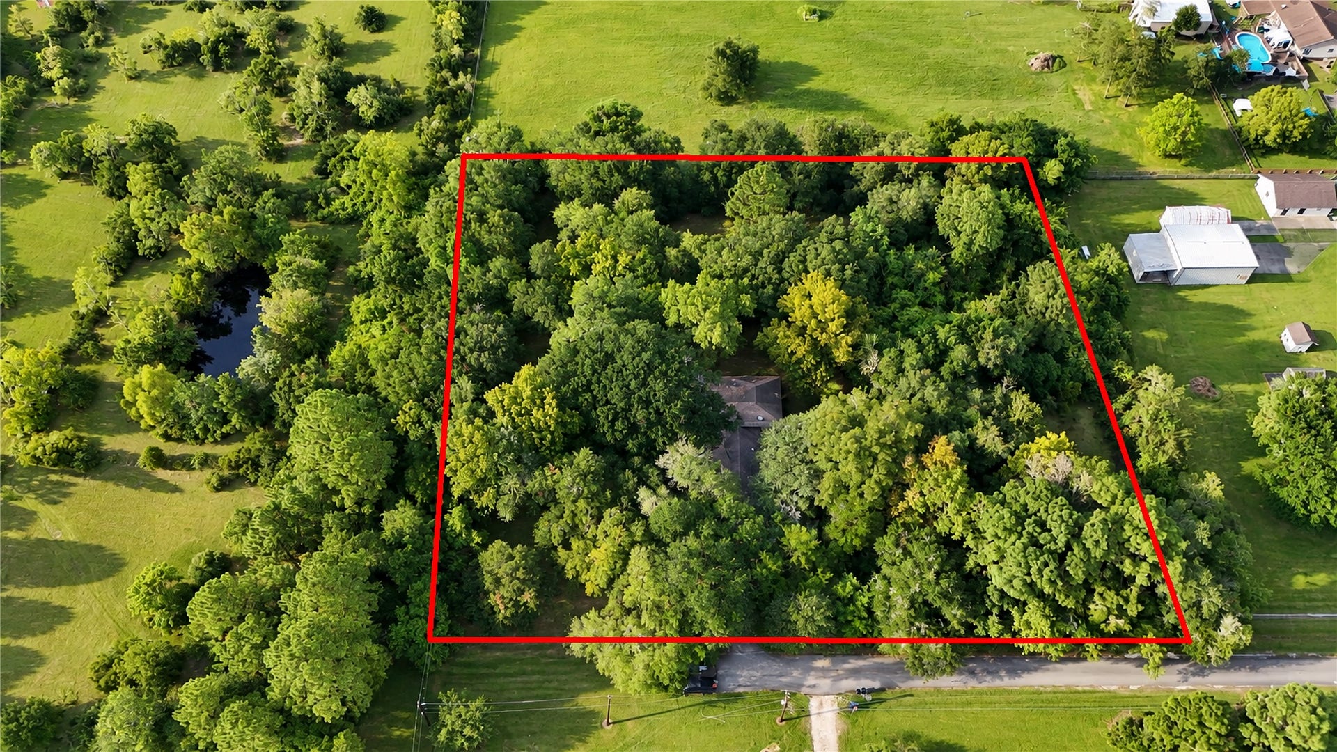 13502 30th Street, Santa Fe, TX 77510 Little over 2 Acres with mature trees and a Pond to the right.