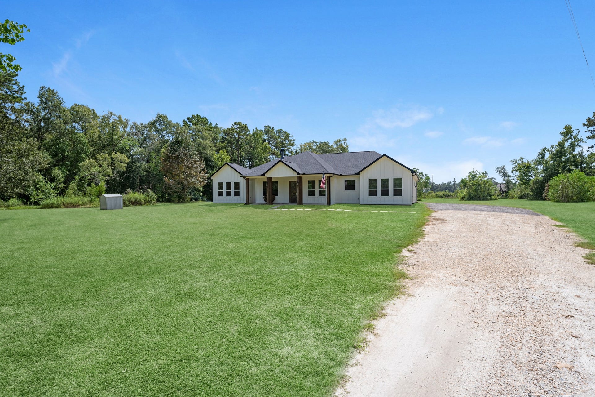 22694 Brook Forest Road, New Caney, TX 77357 Set well back from the road, creating a private arrival and plenty of separation from the street.