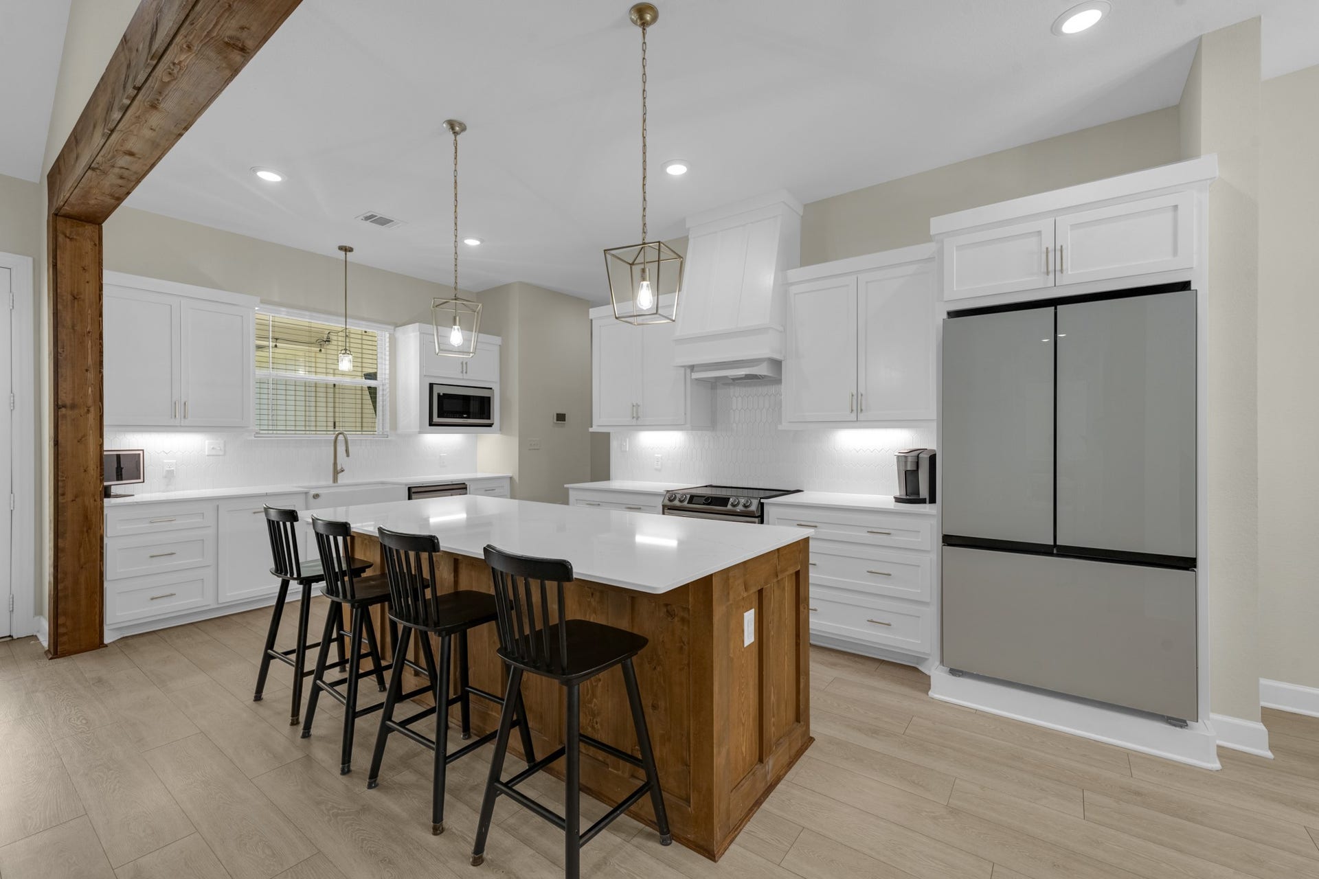 22694 Brook Forest Road, New Caney, TX 77357 WOW! Gorgeous kitchen with HUGE island, Silestone counters, custom cabinetry & upgraded lighting.