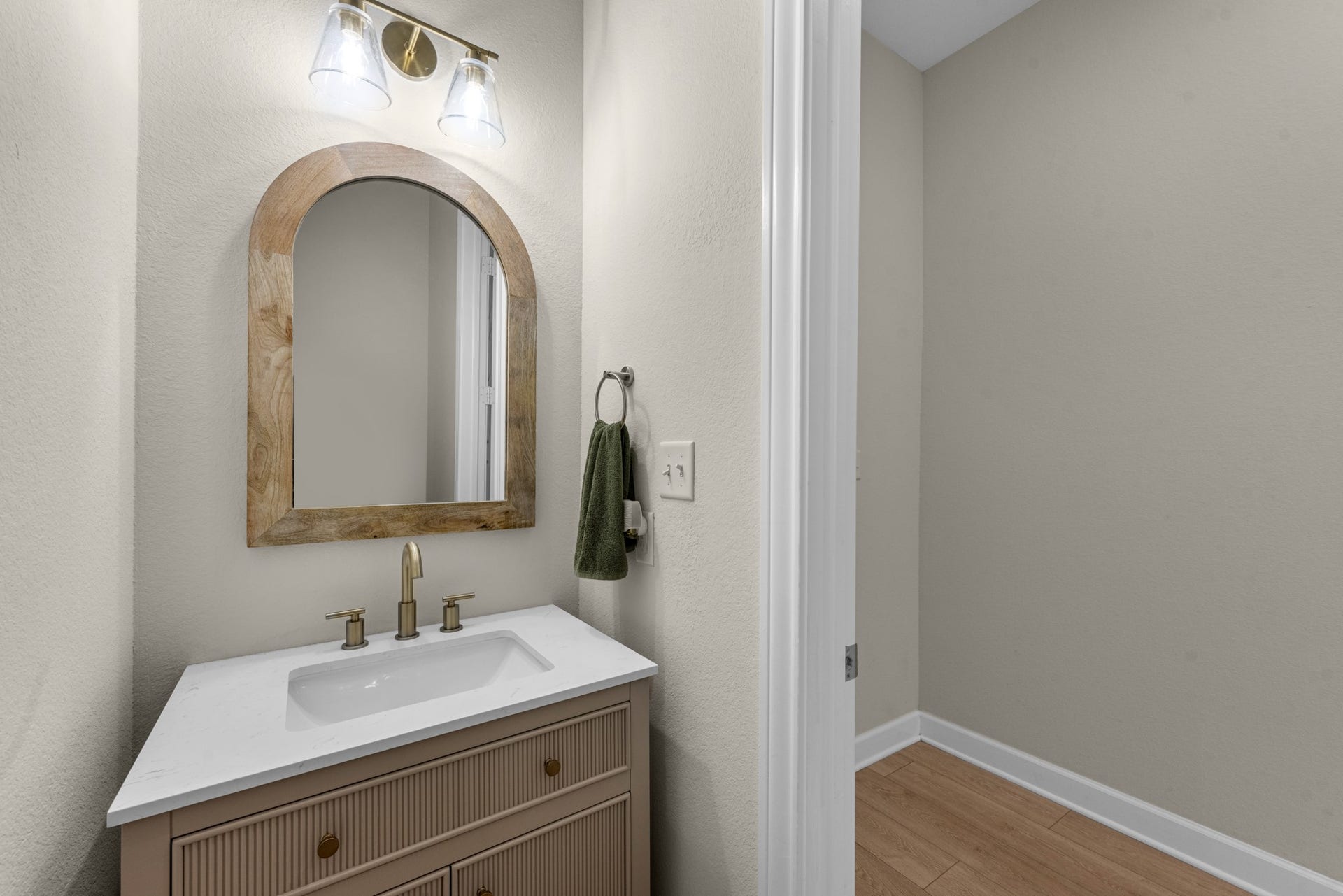 22694 Brook Forest Road, New Caney, TX 77357 Stylish half bath with custom vanity, upgraded mirror & lighting.