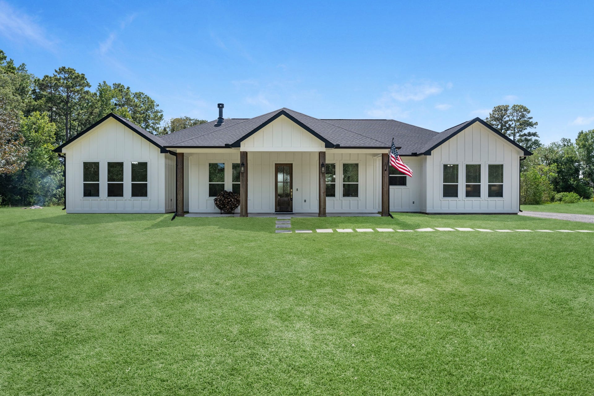 22694 Brook Forest Road, New Caney, TX 77357 Welcome home! - STUNNING curb appeal with a wide covered front porch, wood accents & clean architectural lines.