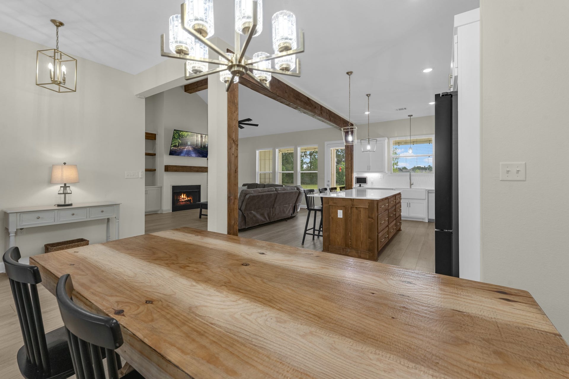 22694 Brook Forest Road, New Caney, TX 77357 Another look at the open kitchen and dining area with beautiful upgraded lighting.