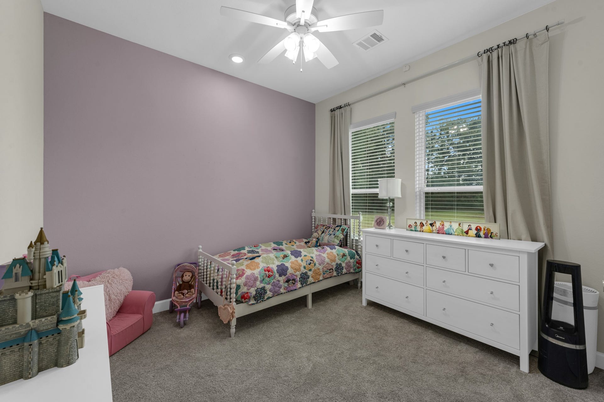 22694 Brook Forest Road, New Caney, TX 77357 Bright secondary bedroom with great windows, ceiling fan & plenty of room.