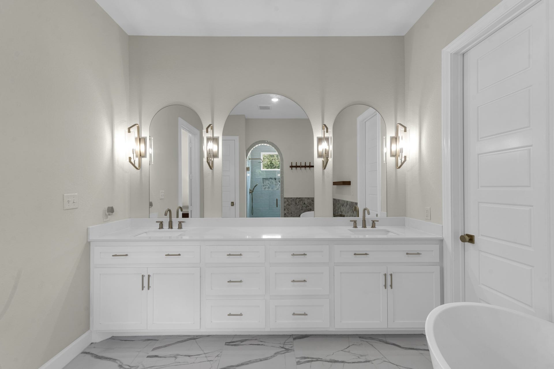 22694 Brook Forest Road, New Caney, TX 77357 Custom cabinetry, dual sinks, custom mirrors & upgraded lighting complete the primary vanity.
