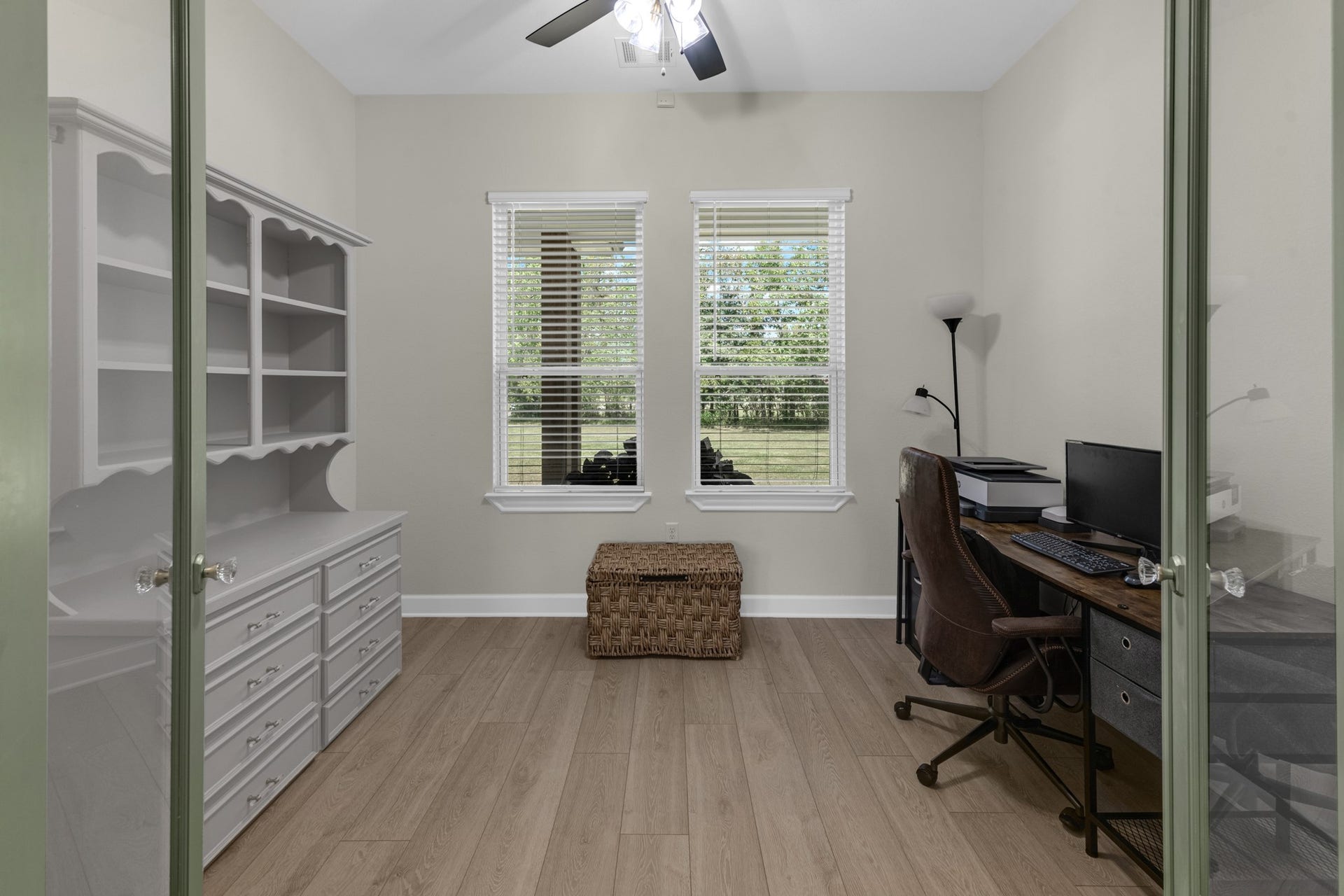 22694 Brook Forest Road, New Caney, TX 77357 Private home office/study with glass French doors, built-ins & beautiful natural light.