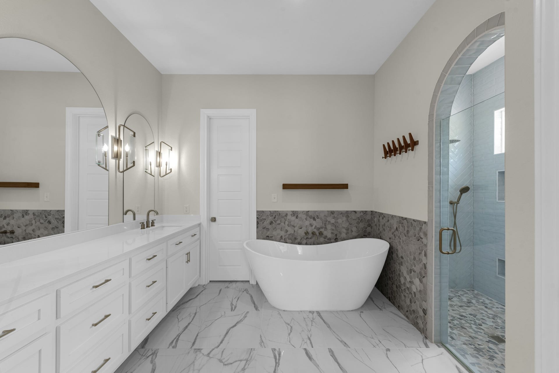 22694 Brook Forest Road, New Caney, TX 77357 Spa-like primary bath with freestanding soaking tub, dual vanities & an incredible walk-in shower.