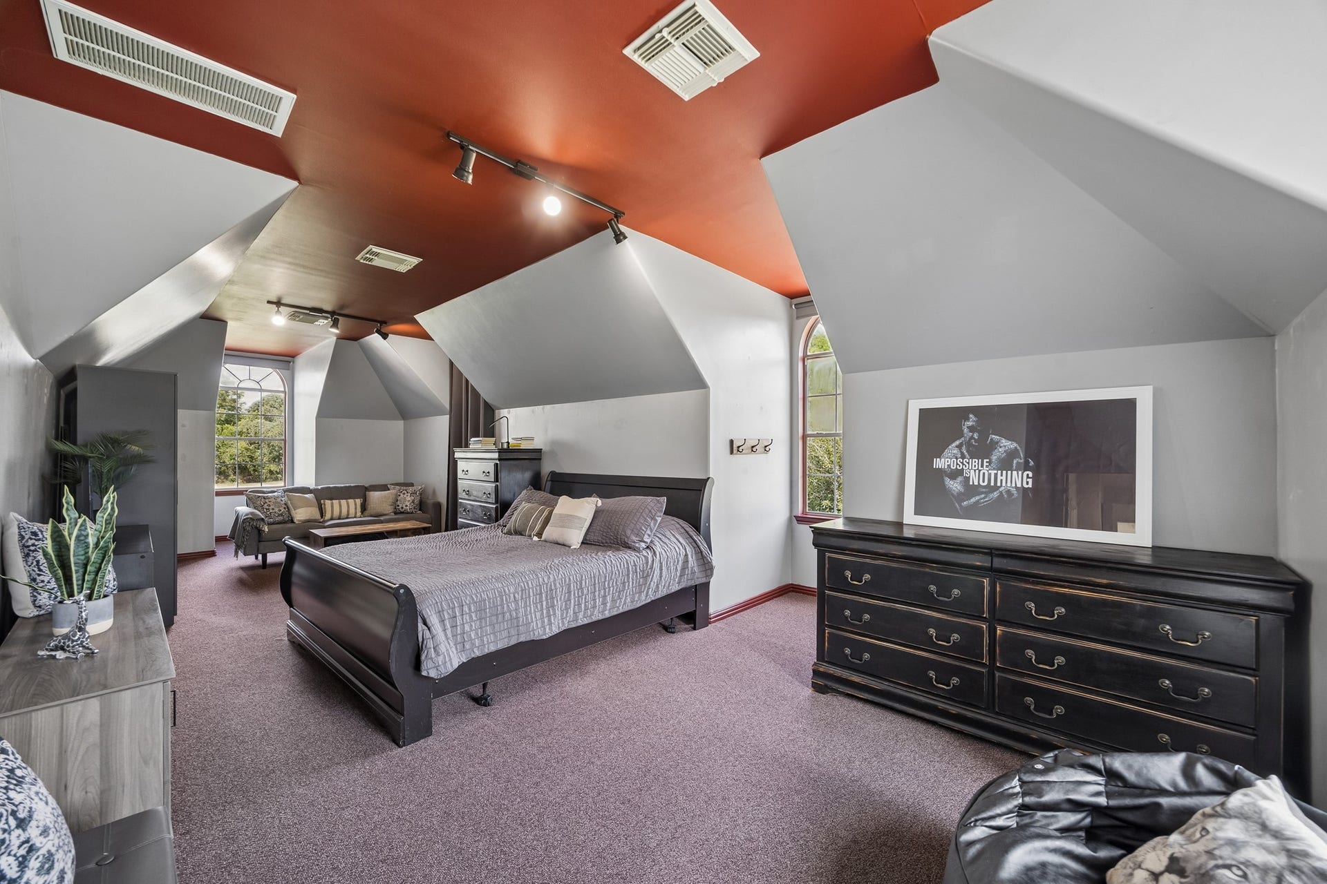 1319 Brazoswood Place, Richmond, TX 77406 This oversized secondary bedroom offers the spacious feel of a second primary retreat, with distinctive angled ceilings, and ample room for a separate sitting area.
