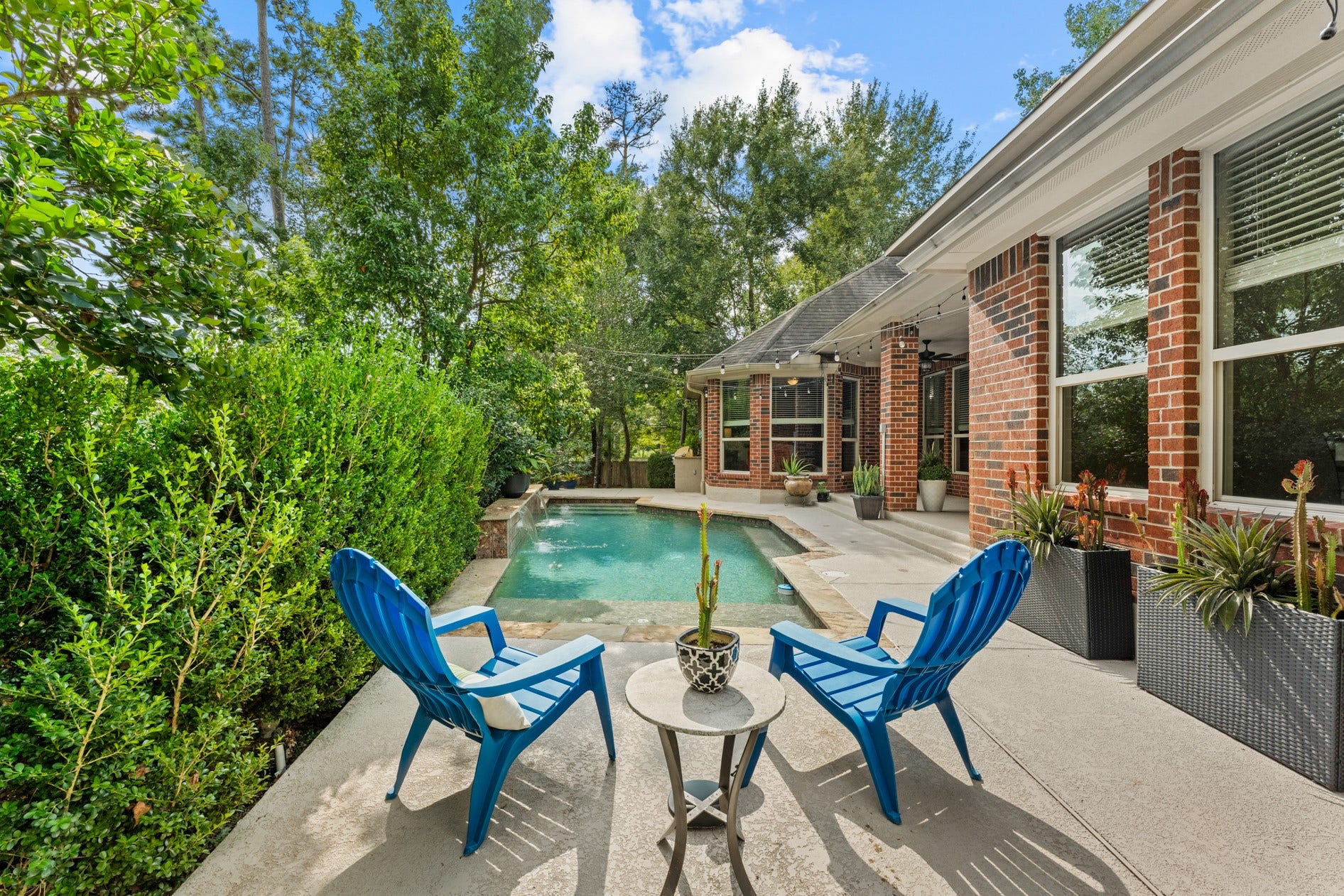 3 Blue Wildflower Pl, The Woodlands, TX 77354 View from the opposite side of the pool.