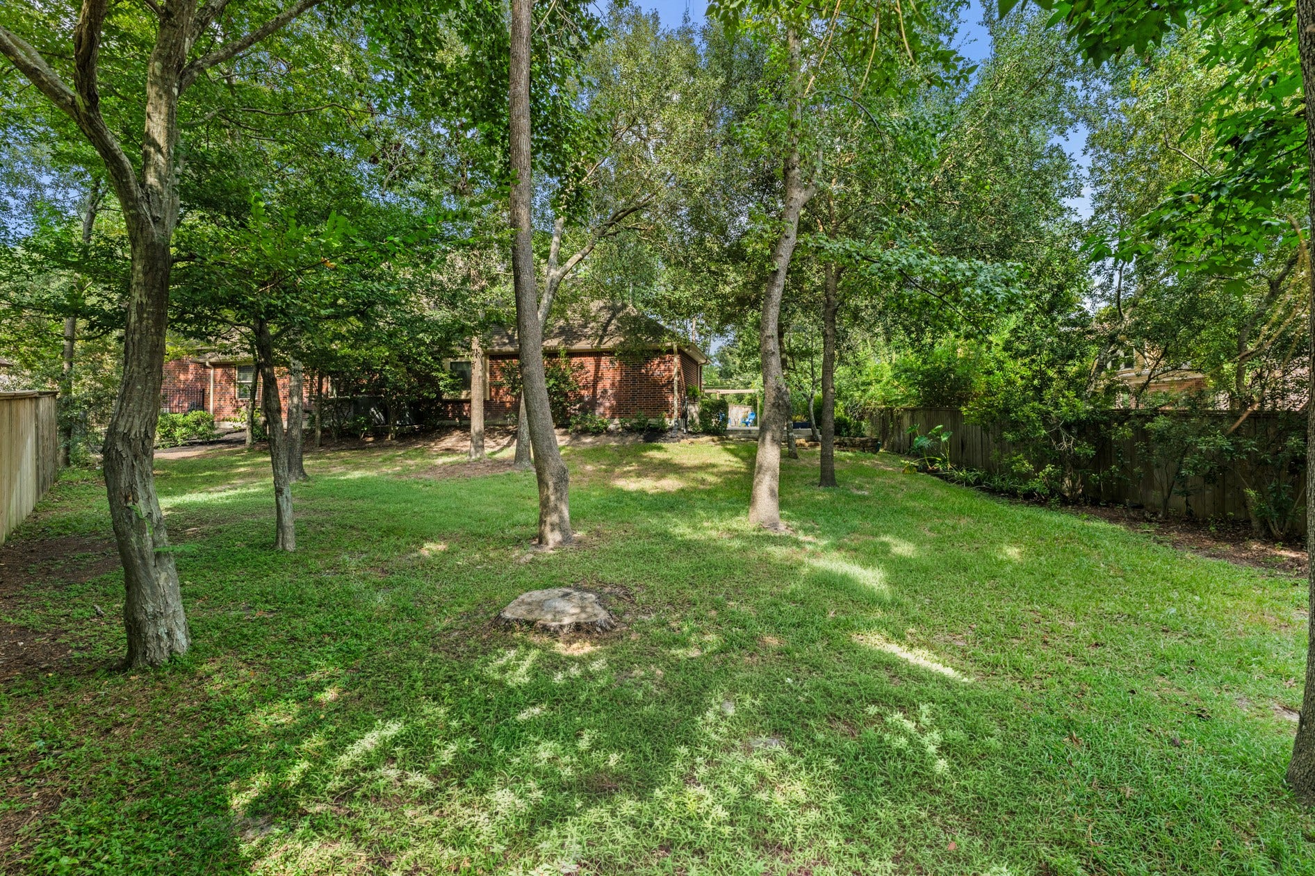3 Blue Wildflower Pl, The Woodlands, TX 77354 The park-like backyard has the perfect mix of trees and lawn area. Plenty of room for people and pets to roam, garden, or play backyard games!