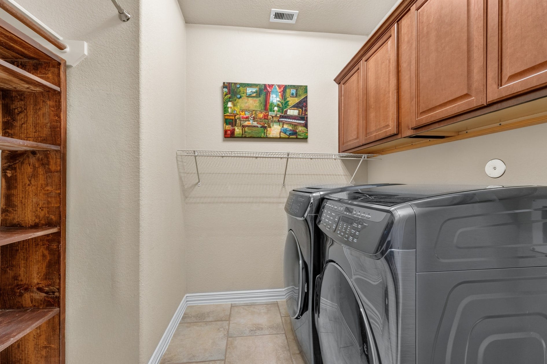 3 Blue Wildflower Pl, The Woodlands, TX 77354 The laundry room provides additional storage for cleaning supplies, vacuums and more!