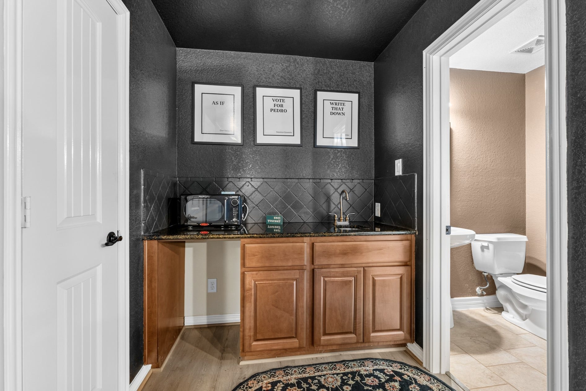 3 Blue Wildflower Pl, The Woodlands, TX 77354 A wet bar area tucked in the back of the media room makes it easy to grab your favorite snacks and beverages! There is also a half-bath!