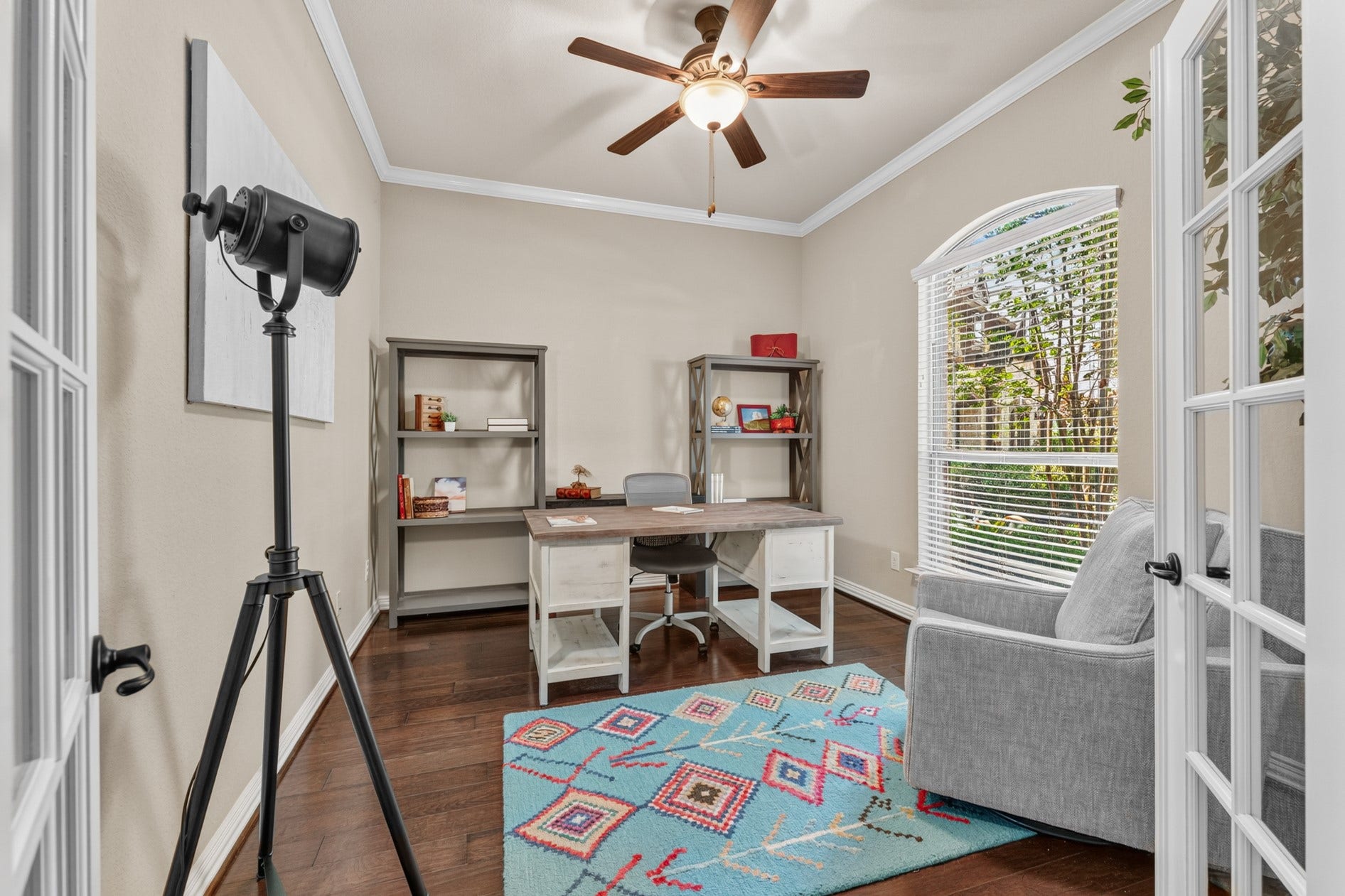 3 Blue Wildflower Pl, The Woodlands, TX 77354 Located at the front of the home, the office provides a quiet space to work. French doors and a large arched window let natural light in. Enjoy a nice view of the front yard while you work!