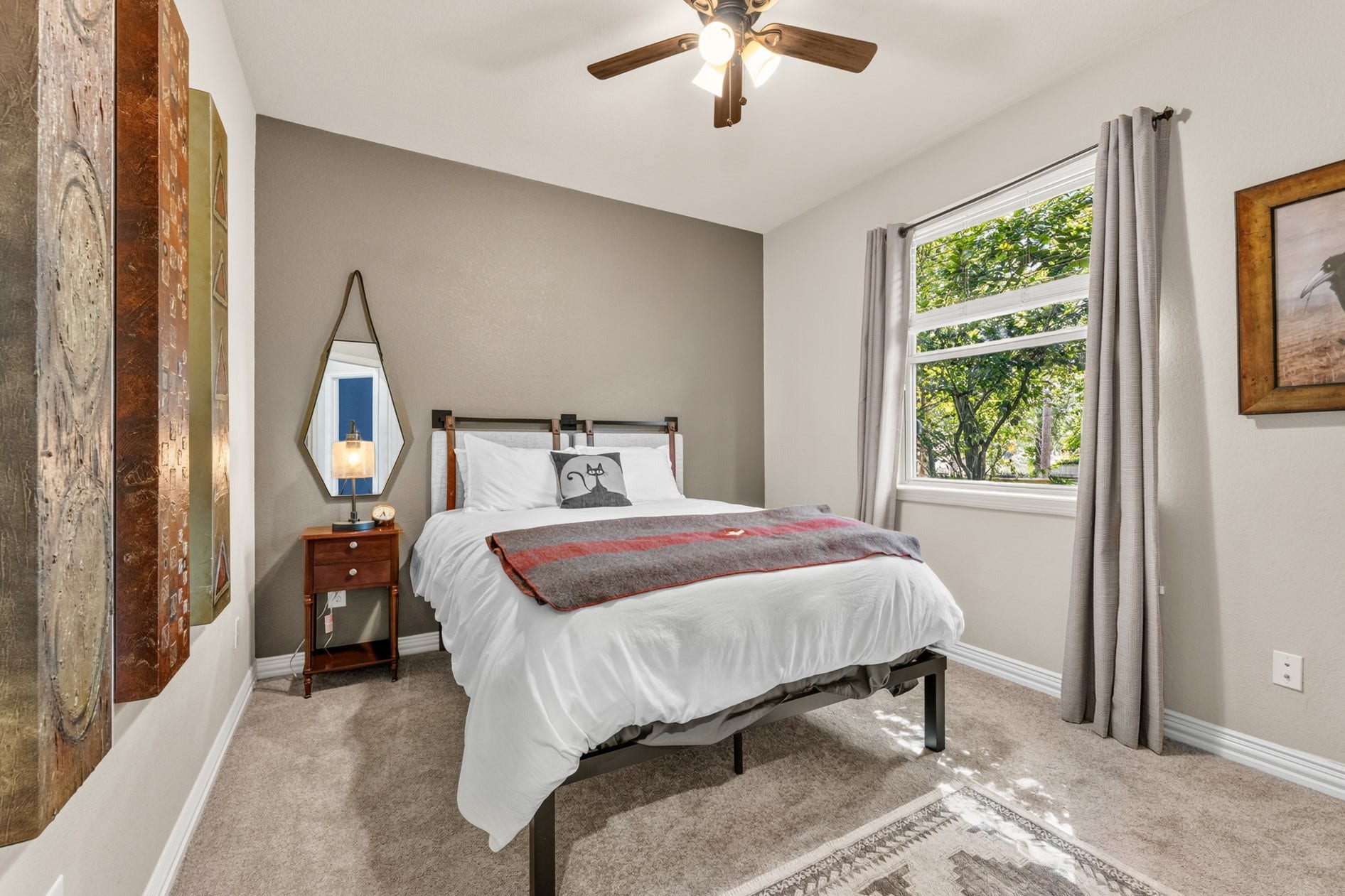 3 Blue Wildflower Pl, The Woodlands, TX 77354 Sunny, second guest bedroom with a view of the park-like yard.