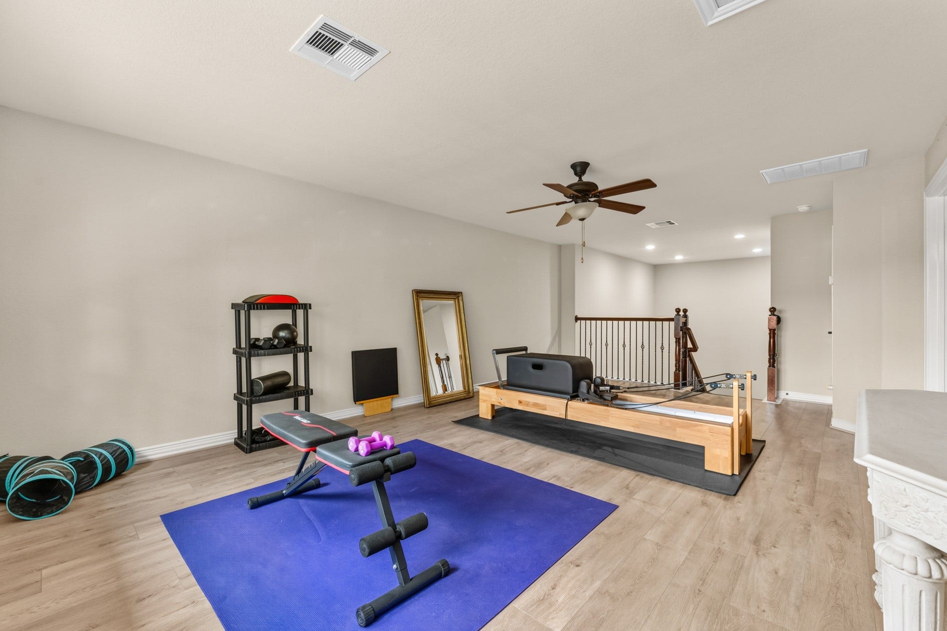 3 Blue Wildflower Pl, The Woodlands, TX 77354 Game room currently being used as a home gym.