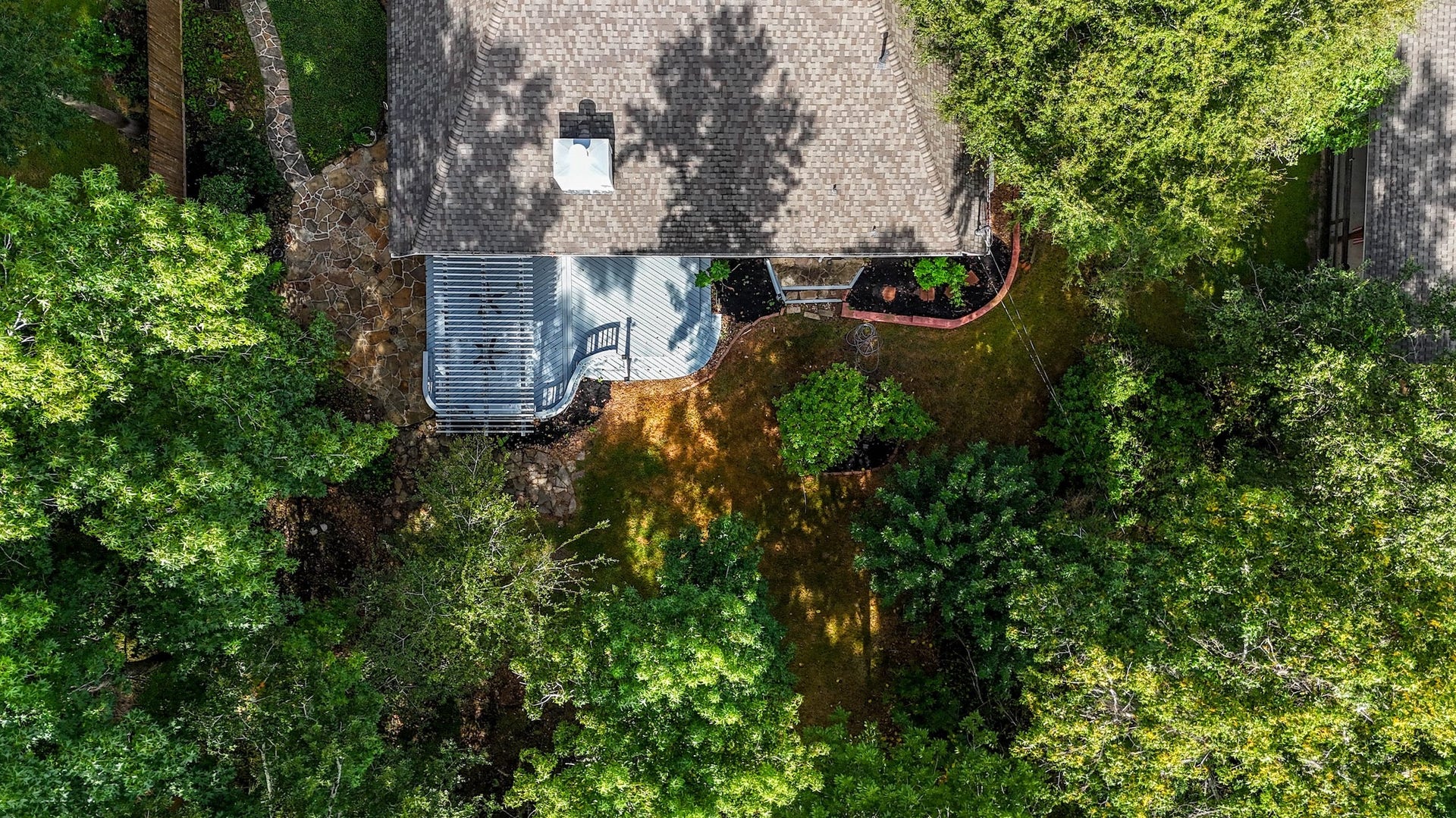 Another drone shot showing how large the back deck and patio!