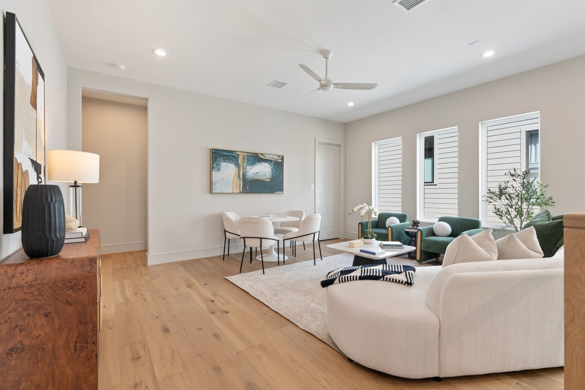 711 E 12th Street, Houston, TX 77008 Abundant windows bring in natural light, while warm hardwood floors carry the homes inviting style.