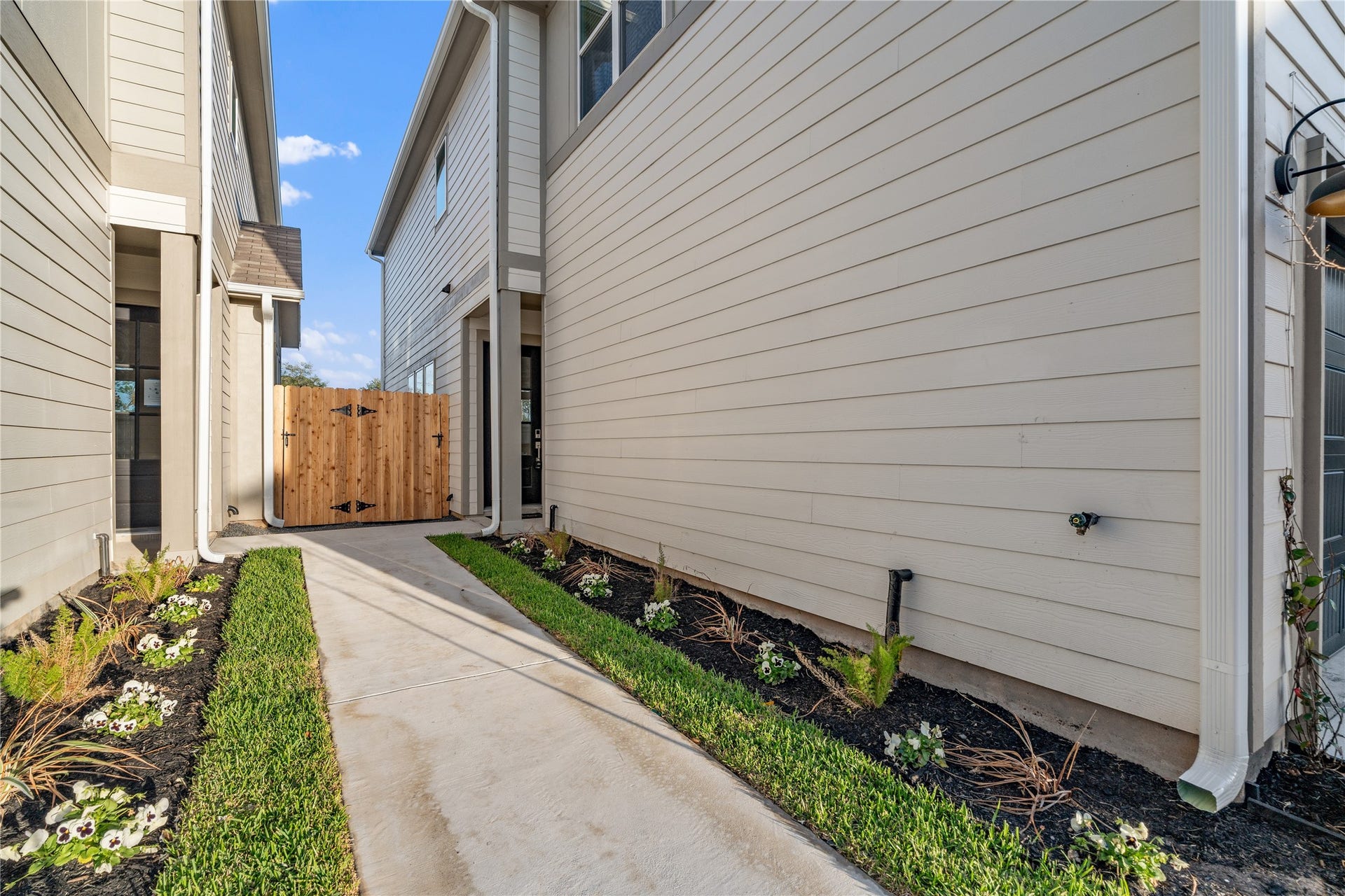 6509 Rena Street, Houston, TX 77092 A landscaped walkway adds separation from the drive and creates a more private approach to the front door.