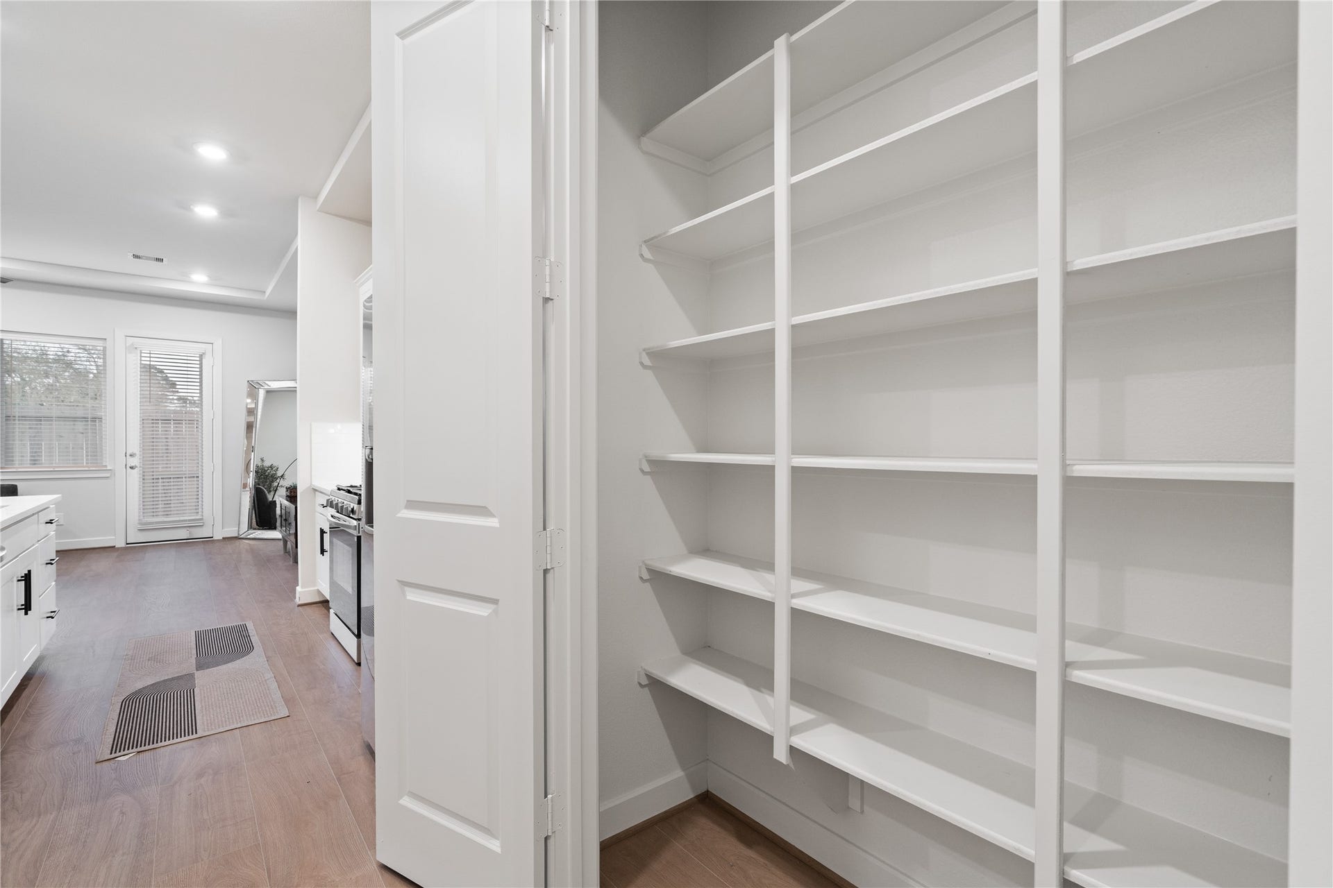6509 Rena Street, Houston, TX 77092 Reach in pantry with built in full height shelving, keeping dry goods and kitchen storage organized and out of sight.