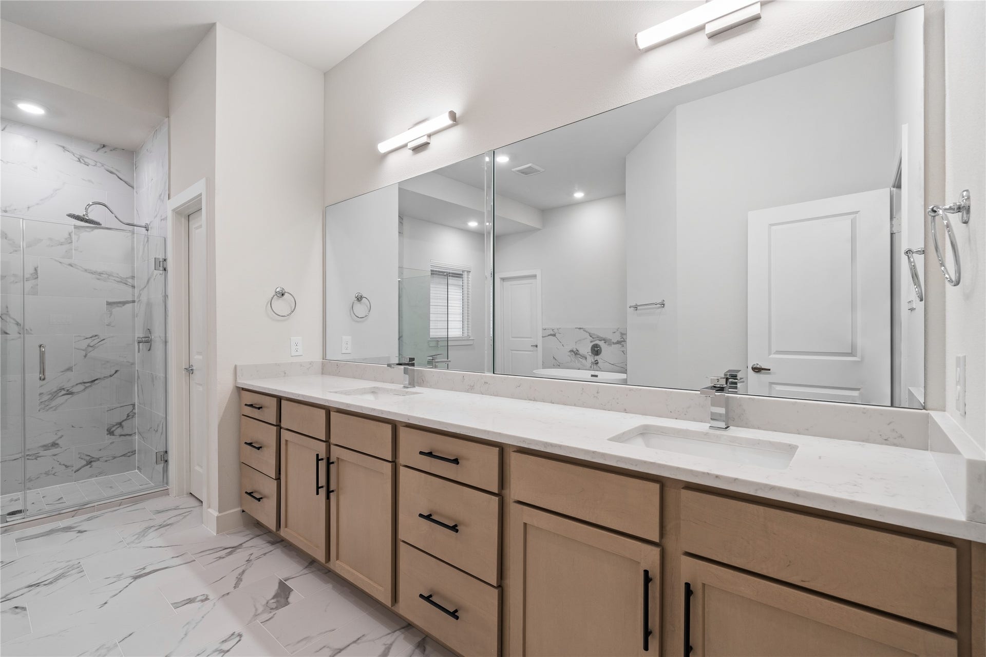 6509 Rena Street, Houston, TX 77092 A primary bath of this size is uncommon at this price point, offering a wide double sink vanity with extended counter space that comfortably allows for a makeup station or added storage.