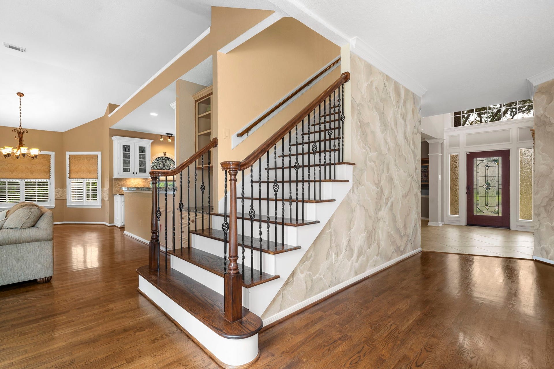 23 Saint Simons Court, Sugar Land, TX 77479 Natural wood and wrought iron create a staircase with clean, simple lines that complement the interior.