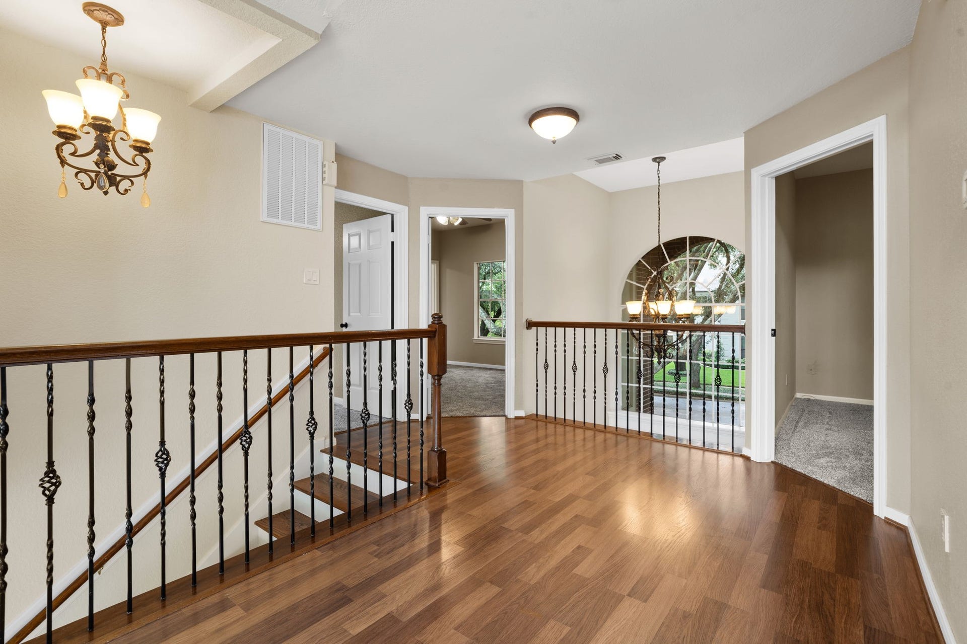 23 Saint Simons Court, Sugar Land, TX 77479 This roomy upstairs hallway offers a bright and airy transition between bedrooms and living areas.