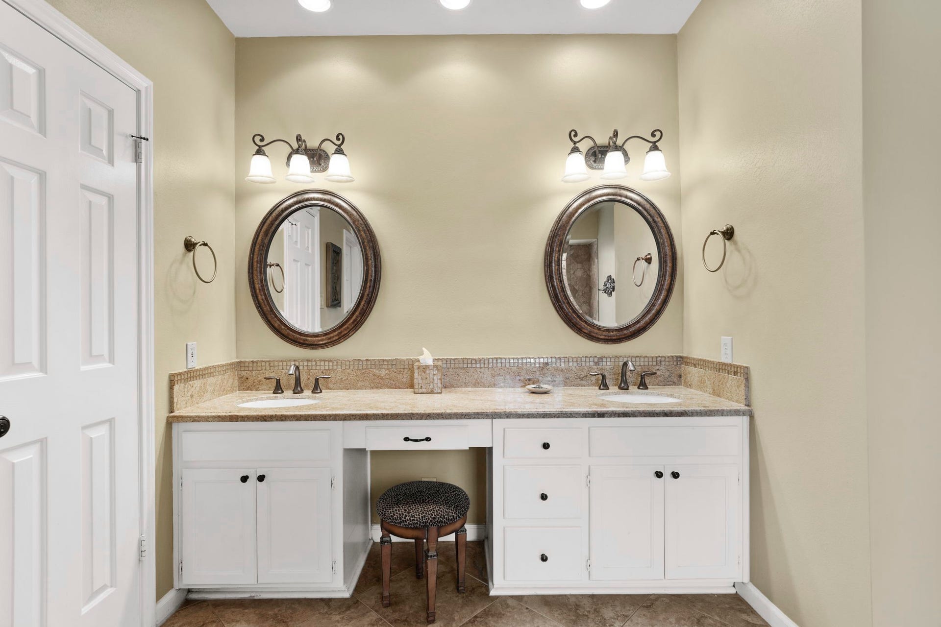 23 Saint Simons Court, Sugar Land, TX 77479 A dual vanity with a dedicated makeup area provides ample space for two, while two walk-in closets with custom built-ins and a separate linen closet offer plenty of storage.