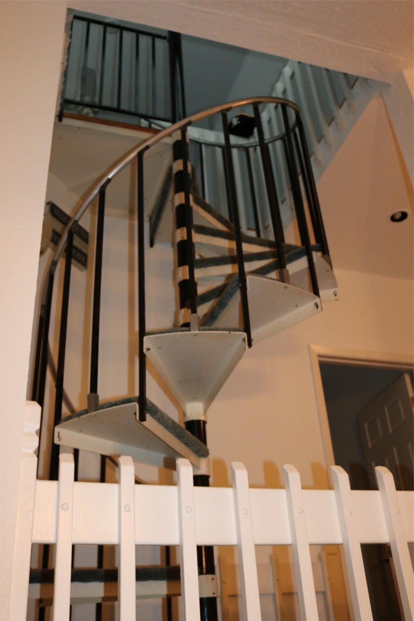 13002 Buccaneer Parkway, Freeport, TX 77541 Spiral staircase ascending to the third level and guest room.