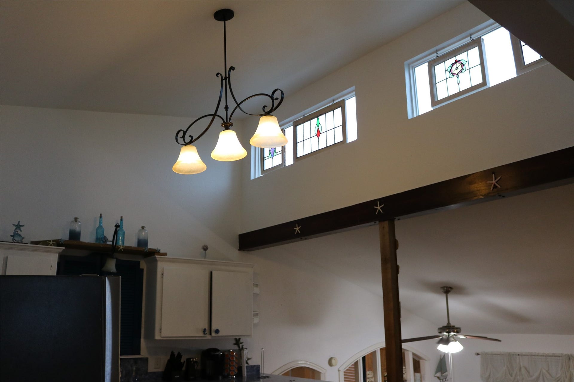 13002 Buccaneer Parkway, Freeport, TX 77541 Elevate your culinary experience with stunning loft windows that flood the kitchen with natural light.