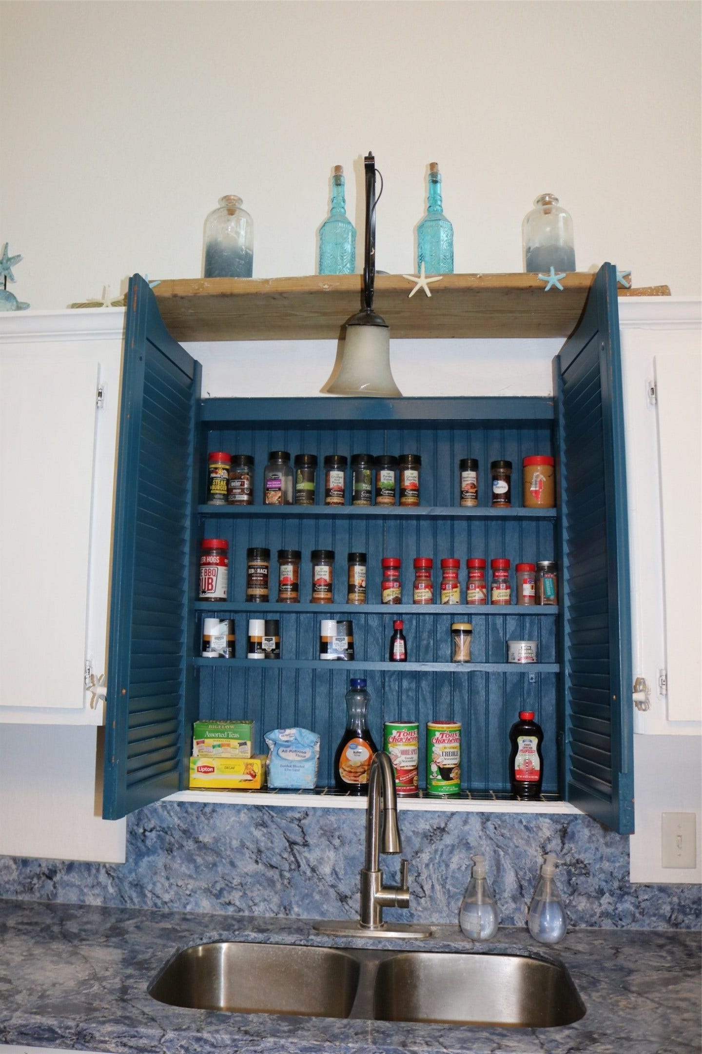 13002 Buccaneer Parkway, Freeport, TX 77541 Conveniently located above the sink, this stylish spice rack adds both functionality and charm to the kitchen.
