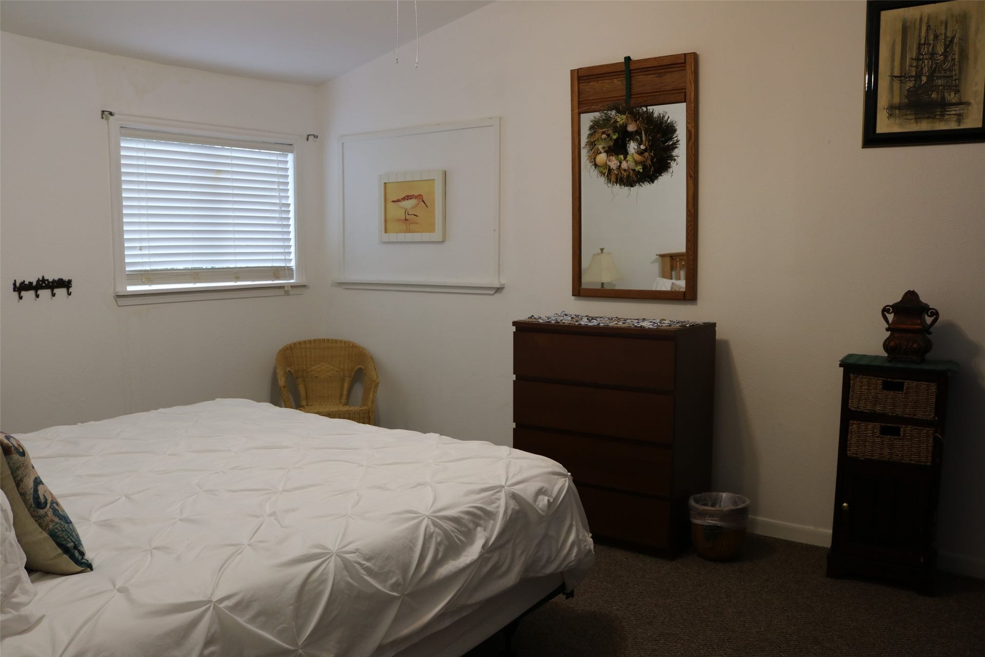 13002 Buccaneer Parkway, Freeport, TX 77541 Spacious guest room featuring a comfortable king-size bed and sturdy dresser.