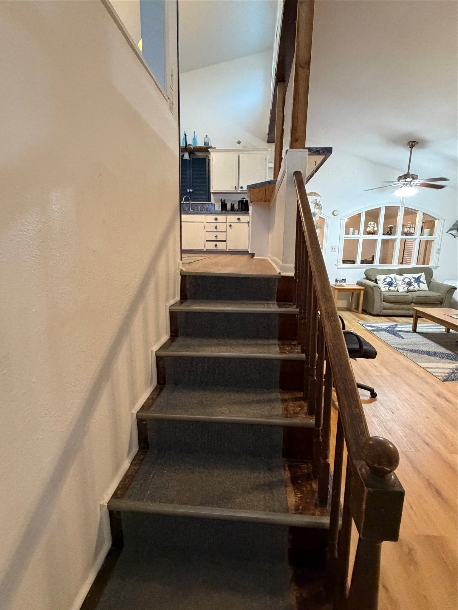 13002 Buccaneer Parkway, Freeport, TX 77541 Seamlessly transition from the cozy family room to the inviting kitchen with these convenient stairs.