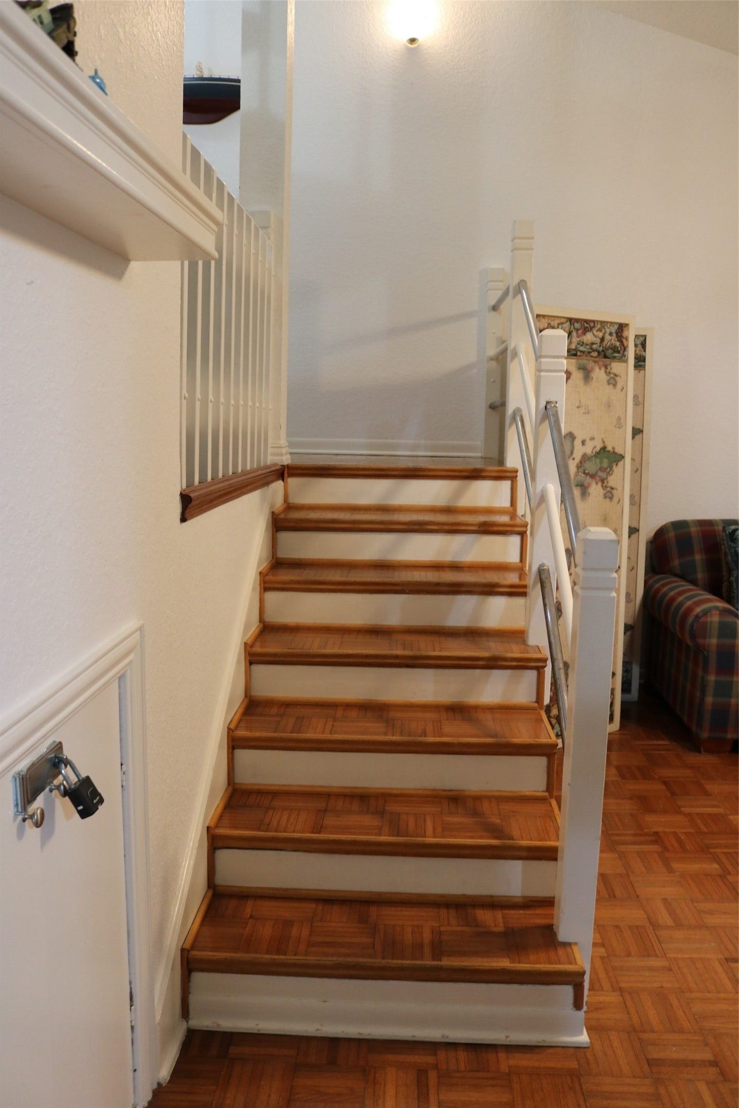 13002 Buccaneer Parkway, Freeport, TX 77541 Ascend from the cozy den/library to the master suite on the second level, featuring a bathroom and a spiral staircase leading to the third level.