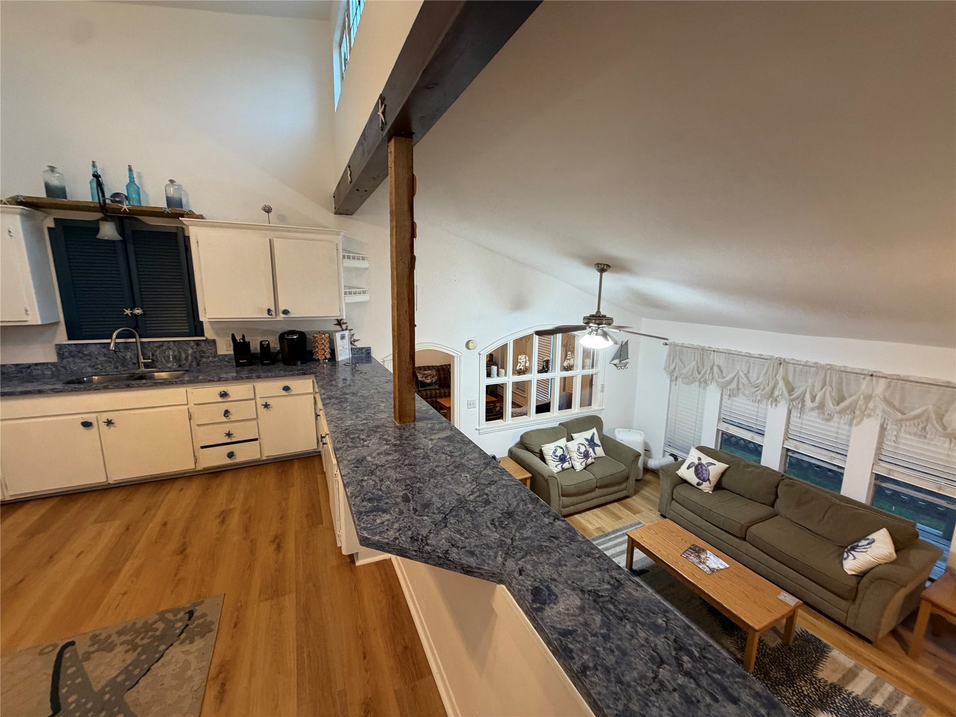 13002 Buccaneer Parkway, Freeport, TX 77541 Stylish kitchen with a sleek breakfast bar, perfect for casual dining and entertaining.