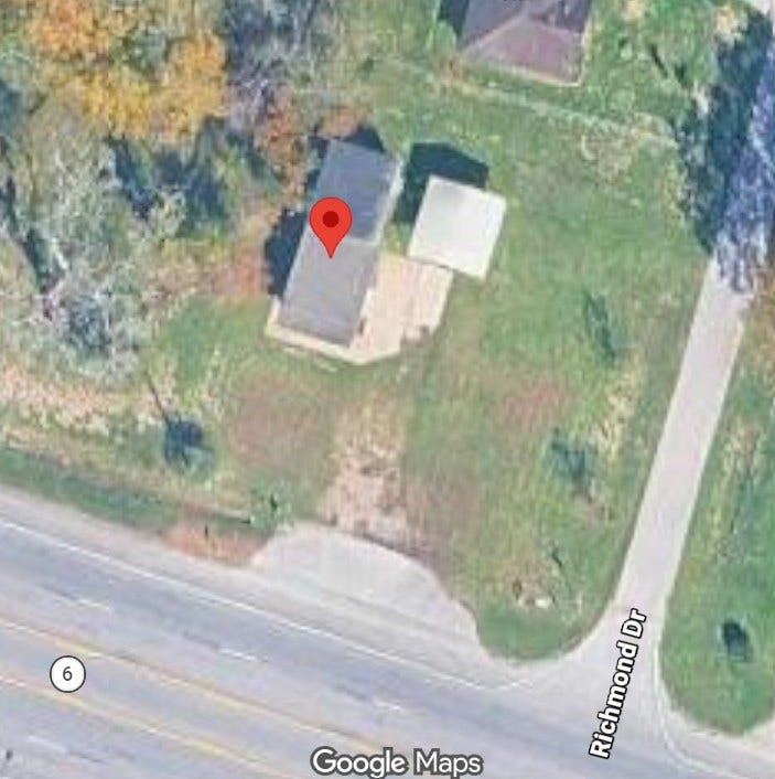 6510 Highway 6, Hitchcock, TX 77563 Experience a prime location with this bird's-eye view of a charming home nestled on a lush, spacious corner lot, offering easy access to Richmond Drive and Highway 6.