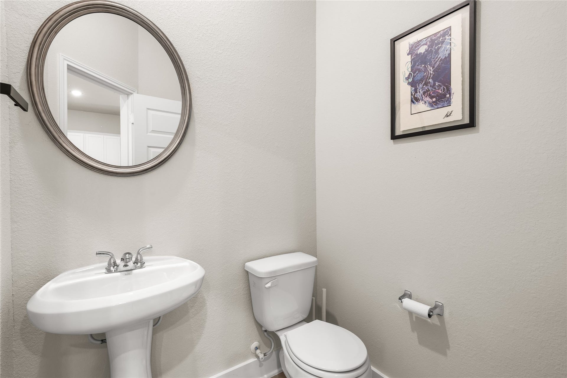4001 Baja Lane, Houston, TX 77045 Conveniently located on the first floor, the powder bath allows guests easy access without disrupting the privacy of the home's upstairs living quarters.