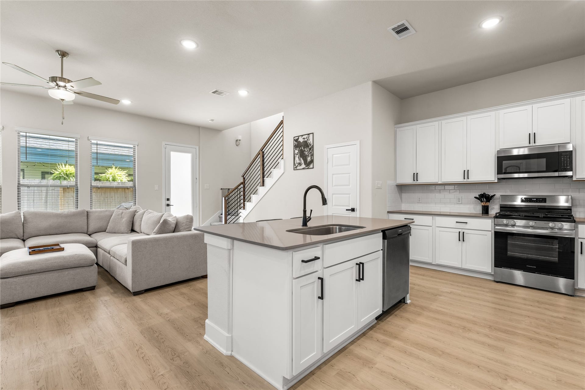 4001 Baja Lane, Houston, TX 77045 Abundant cabinetry, a walk-in pantry, and stainless steel appliances ensure the kitchen is equipped for both everyday convenience and long-term functionality, with storage thoughtfully integrated throughout the space.