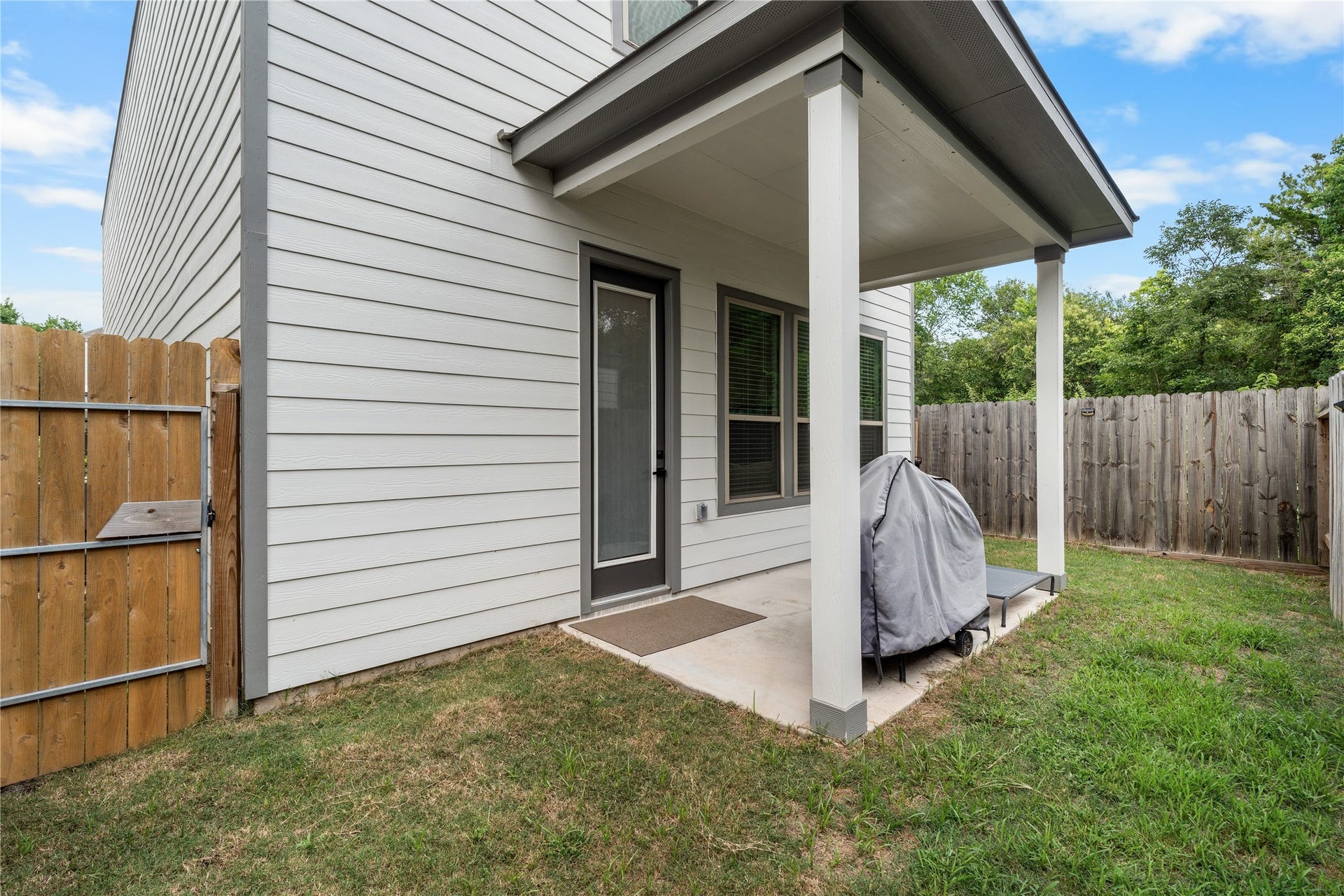 4001 Baja Lane, Houston, TX 77045 The covered patio extends the living space outdoors, creating a comfortable setting for morning coffee, weekend grilling, or unwinding at the end of the day.