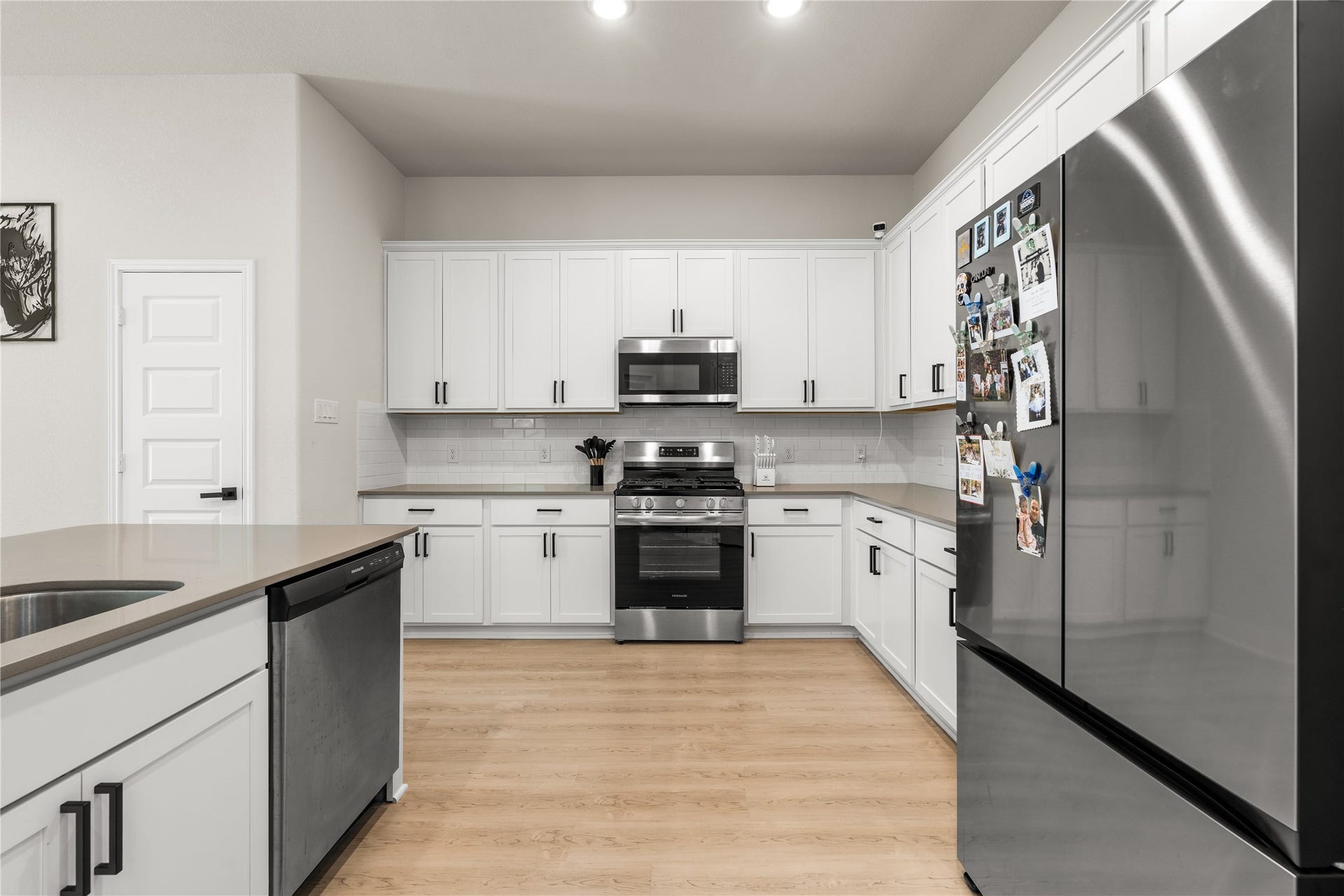 4001 Baja Lane, Houston, TX 77045 Thoughtfully designed with everyday living in mind, the kitchen offers generous circulation space that allows multiple people to cook, gather, and move comfortably without interrupting the flow of the room.