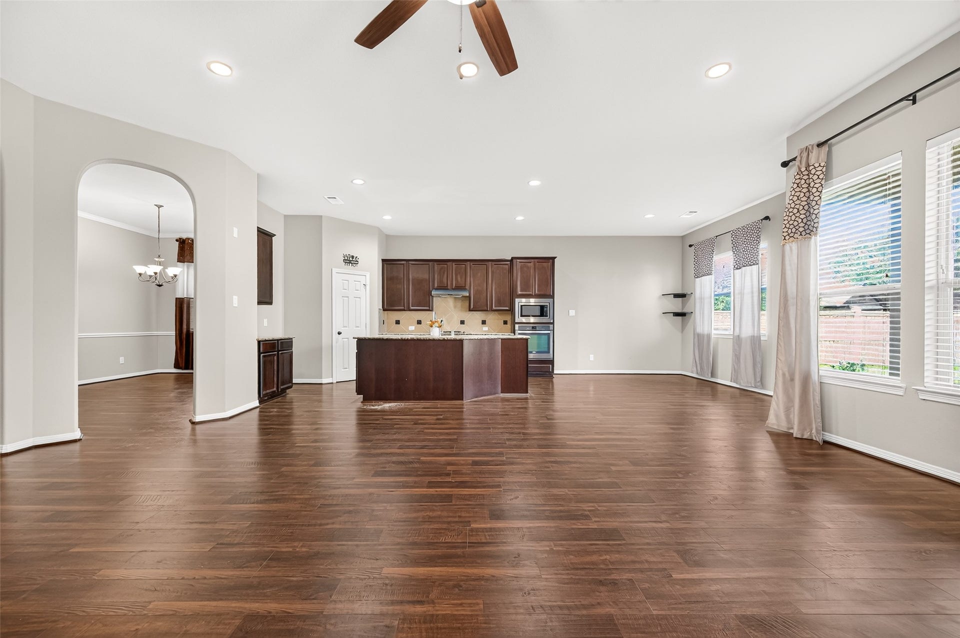 4314 Kent Ranch Court, Katy, TX 77494 Open-concept view across the living room to the kitchen and breakfast area.