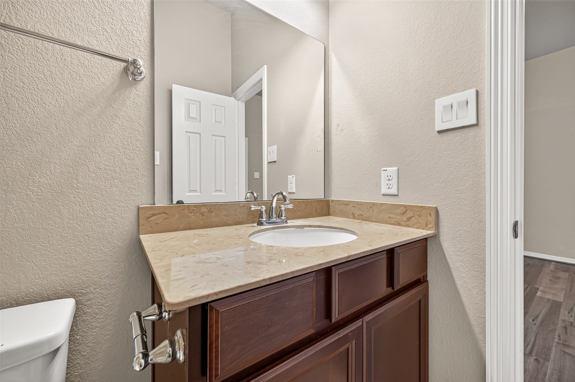 4314 Kent Ranch Court, Katy, TX 77494 Ensuite bathroom vanity with stone-look countertop and towel bar.