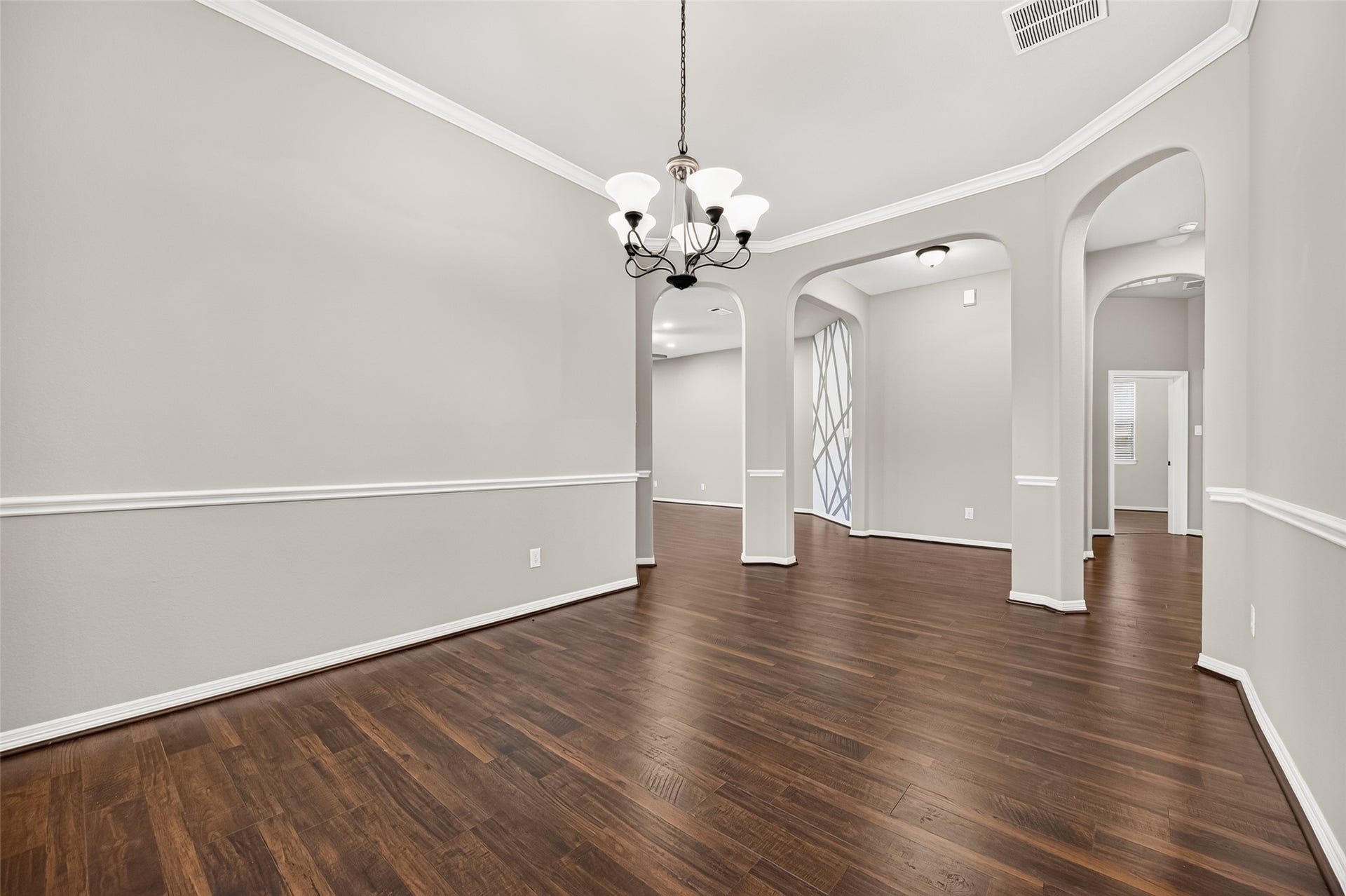 4314 Kent Ranch Court, Katy, TX 77494 Formal dining room with arched openings to the entry and living areas.