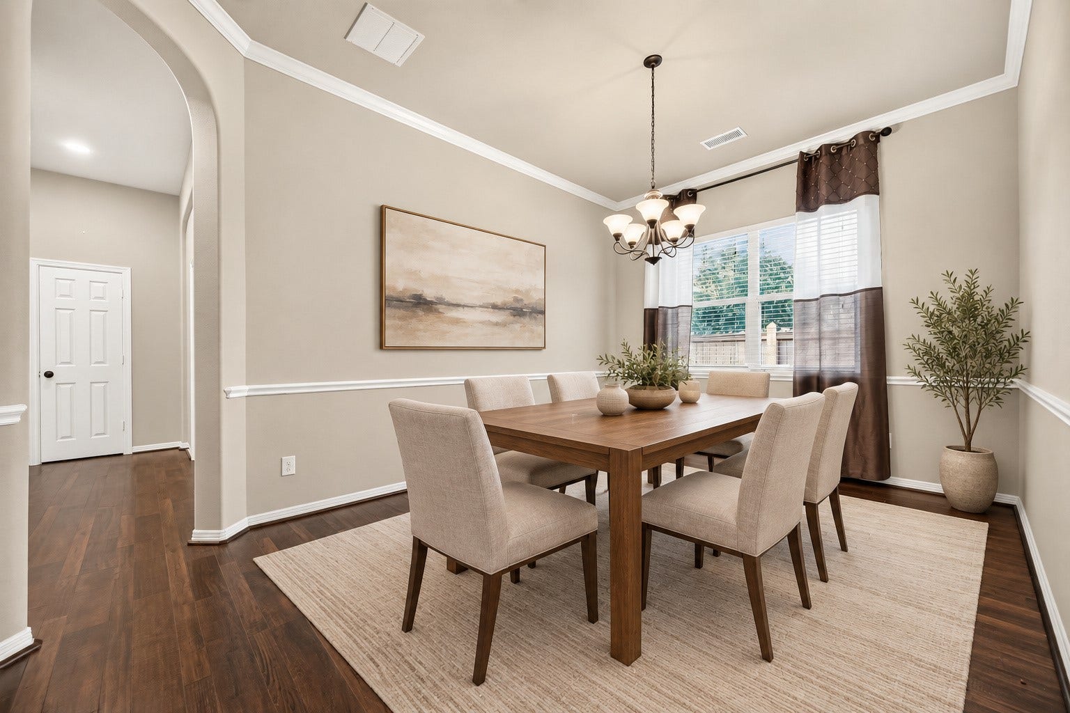 4314 Kent Ranch Court, Katy, TX 77494 Formal dining room - virtually staged. Chandelier, chair rail and crown molding.