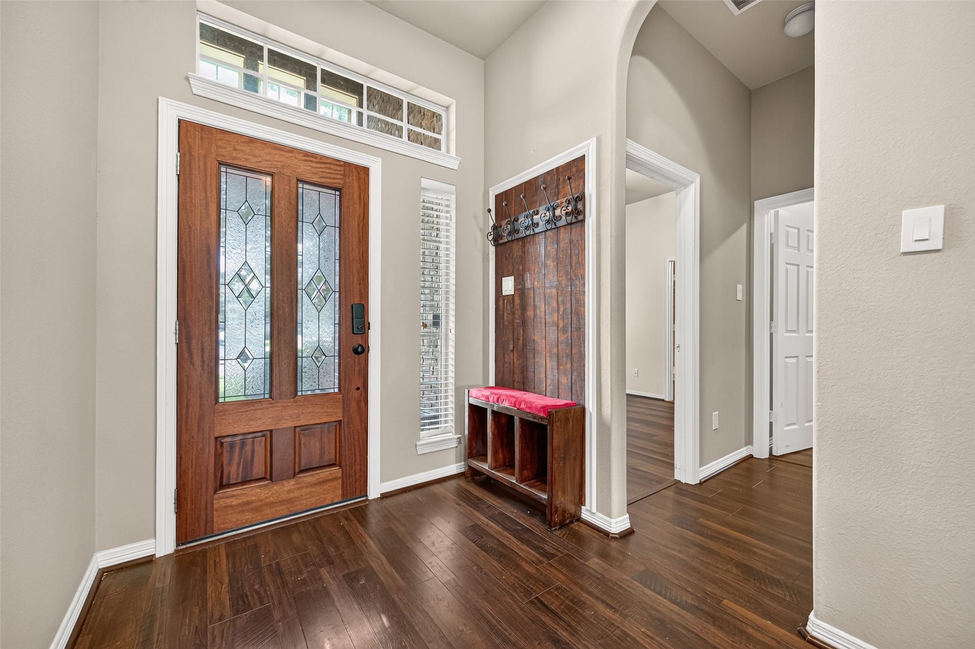 4314 Kent Ranch Court, Katy, TX 77494 Foyer with leaded-glass front door, transom windows and a drop zone with bench and coat hooks.