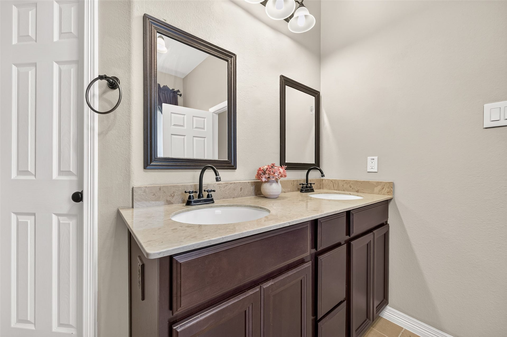 4314 Kent Ranch Court, Katy, TX 77494 Primary bath vanity with dual sinks and bronze-finish fixtures.