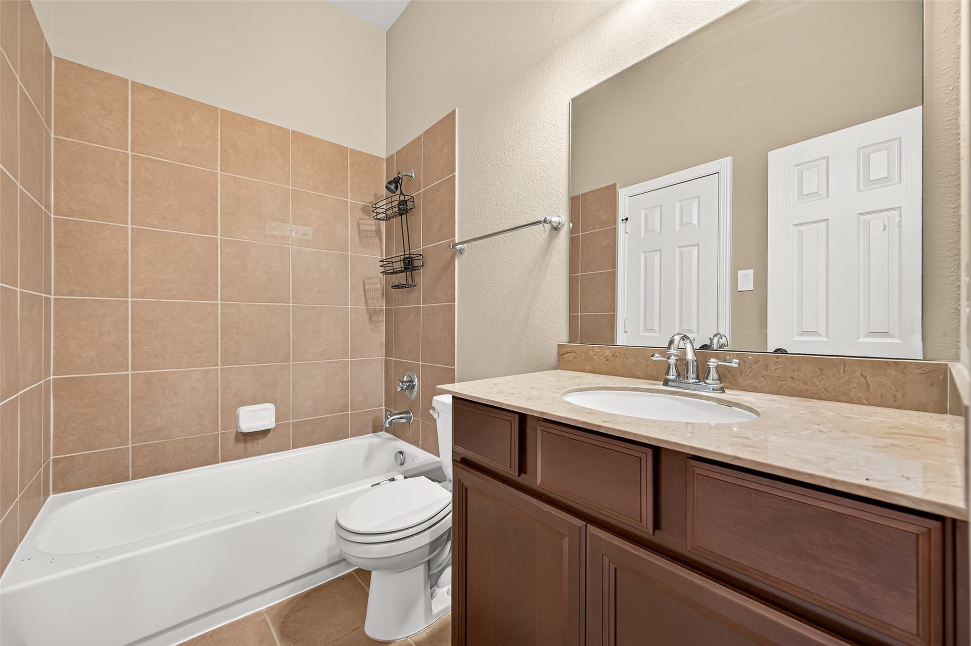 4314 Kent Ranch Court, Katy, TX 77494 Full ensuite bath with tub/shower combo, tile surround and espresso vanity.