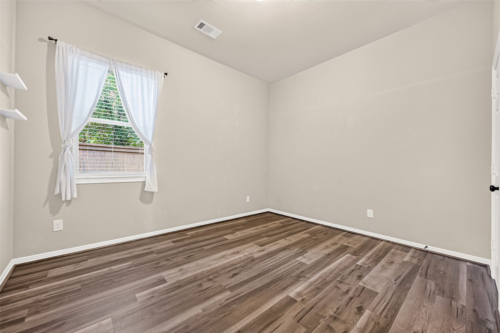 4314 Kent Ranch Court, Katy, TX 77494 Secondary bedroom with window overlooking the backyard.